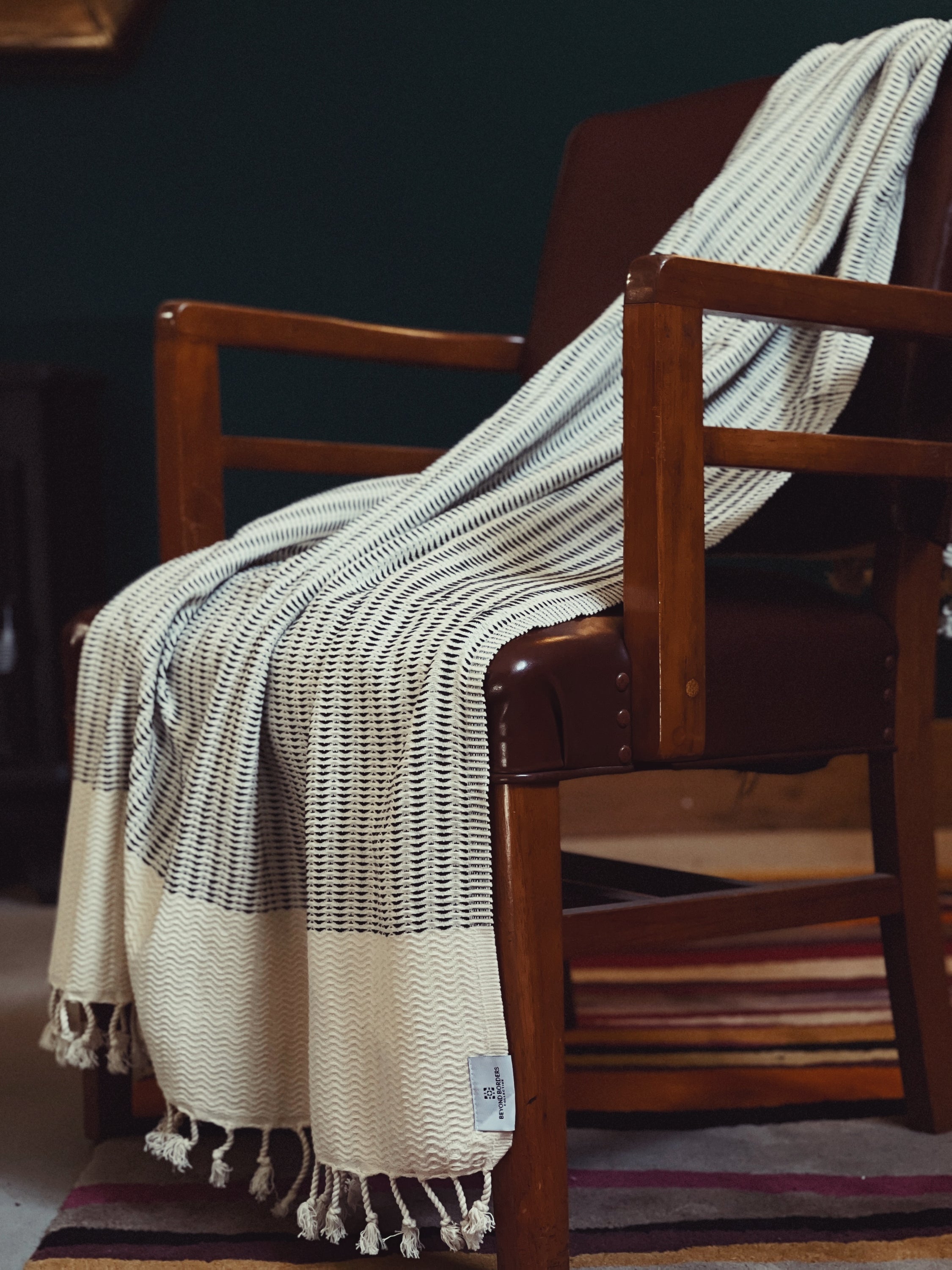 Esinti Turkish Cotton Towel in Onyx Black, showcasing its soft texture and versatile design, perfect for beach or home use.