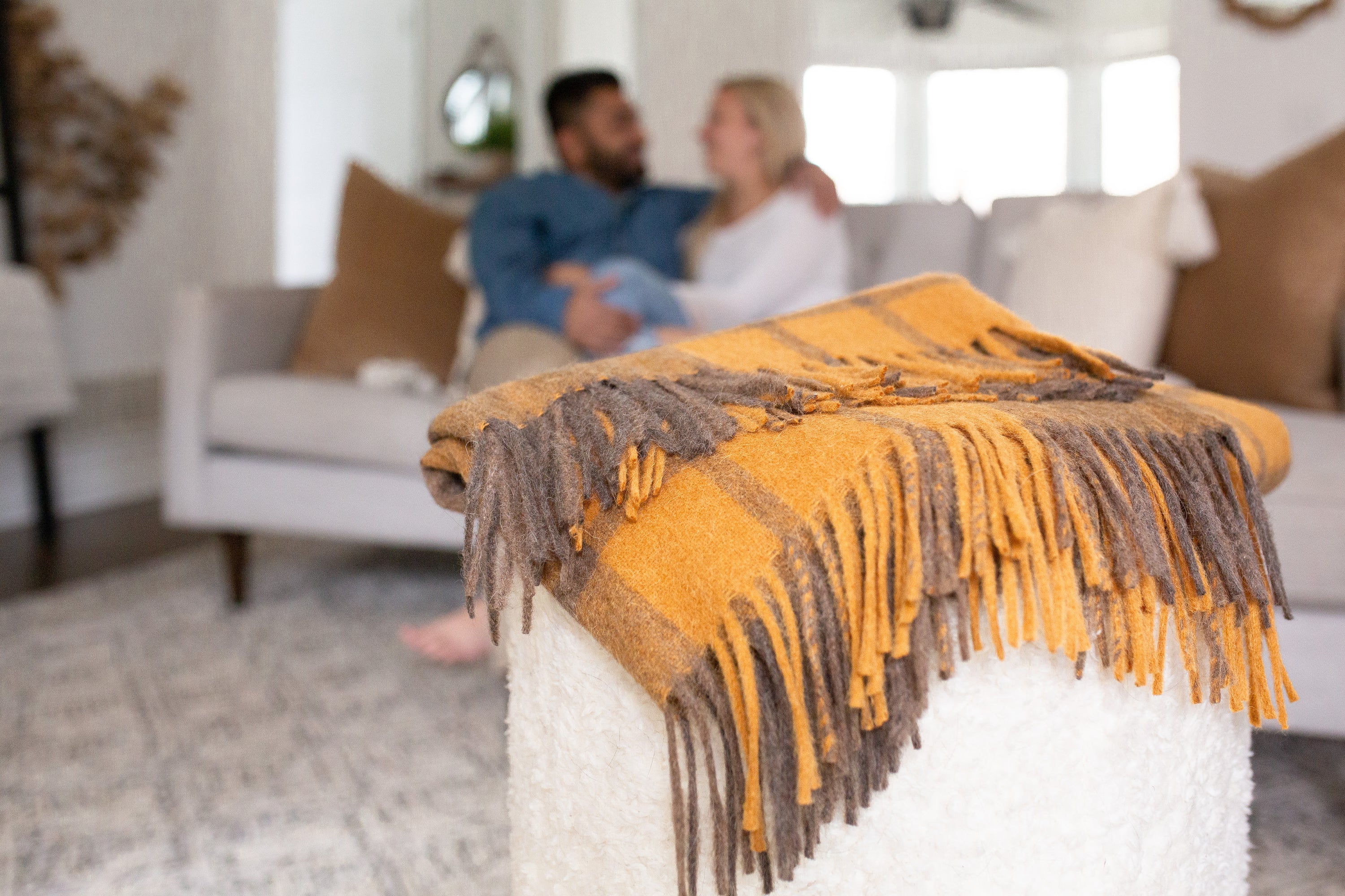 Estancia Alpaca Blend Throw in Grey and Mustard Yellow, showcasing its soft texture and elegant design.