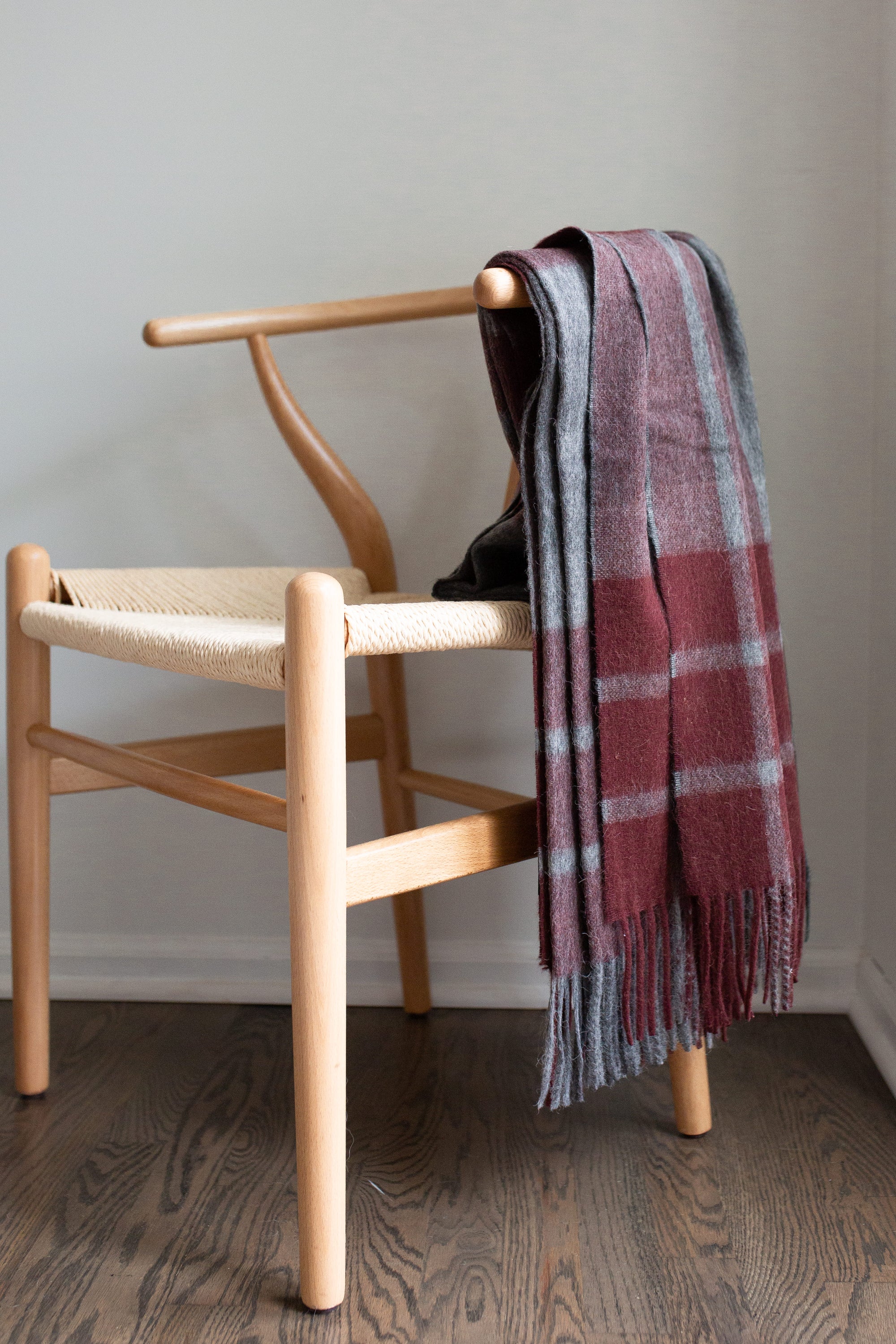 Estancia Alpaca Blend Throw in Grey and Wine, showcasing its soft texture and elegant design, perfect for home decor.