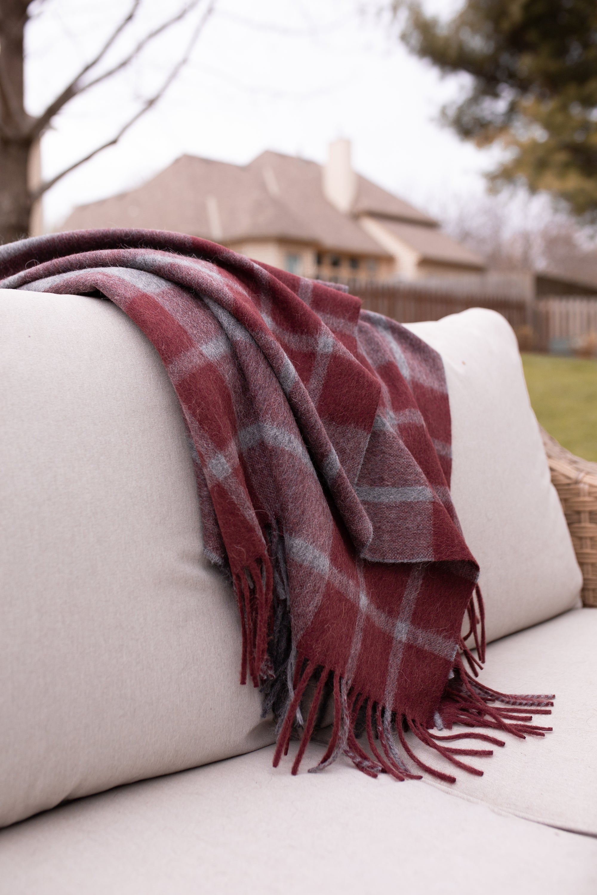 Estancia Alpaca Blend Throw in Grey and Wine, showcasing its soft texture and elegant design, perfect for home decor.