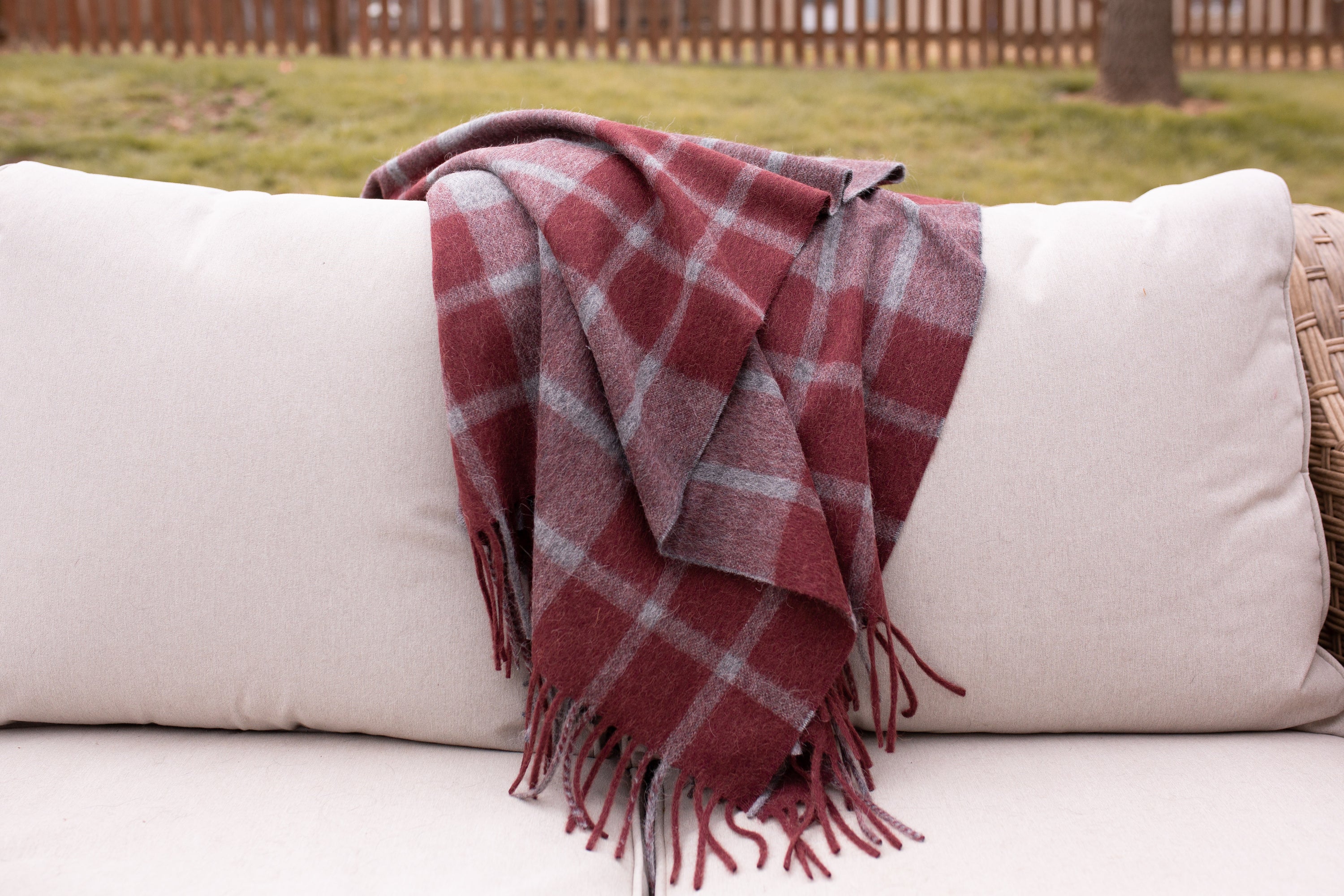 Estancia Alpaca Blend Throw in Grey and Wine, showcasing its soft texture and elegant design, perfect for home decor.