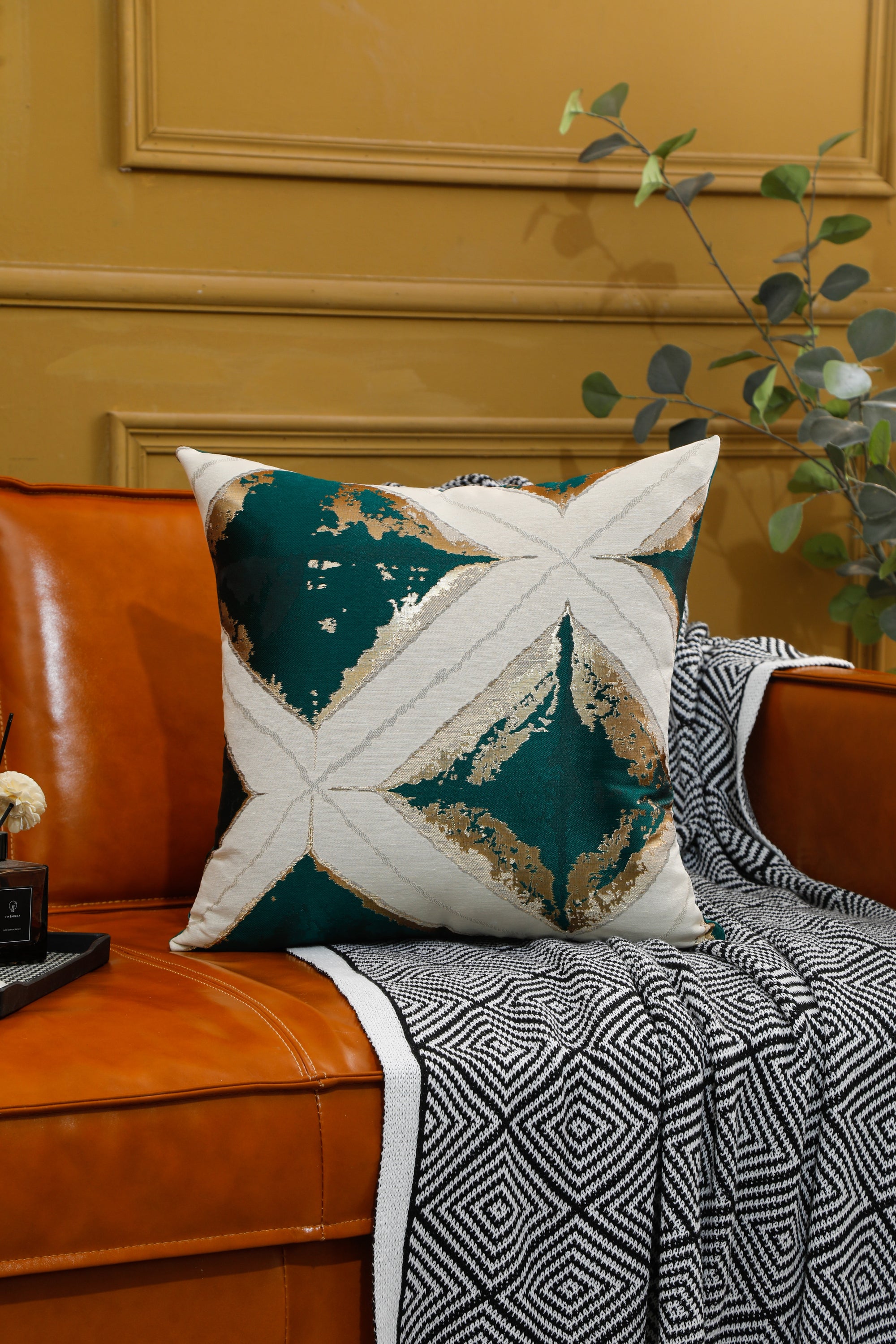 Geometric pattern cushion cover in orange and green, 45cm x 45cm, showcasing modern design and vibrant colors.