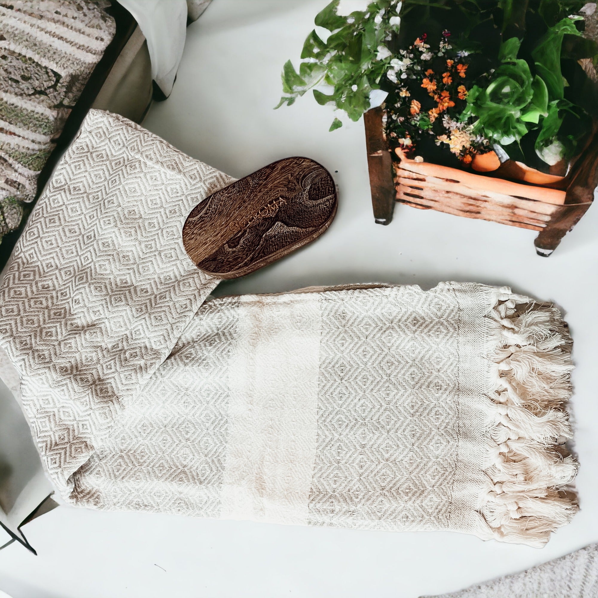 Haley Diamond Towel in blue with decorative tassels, showcasing its oversized design and soft texture.