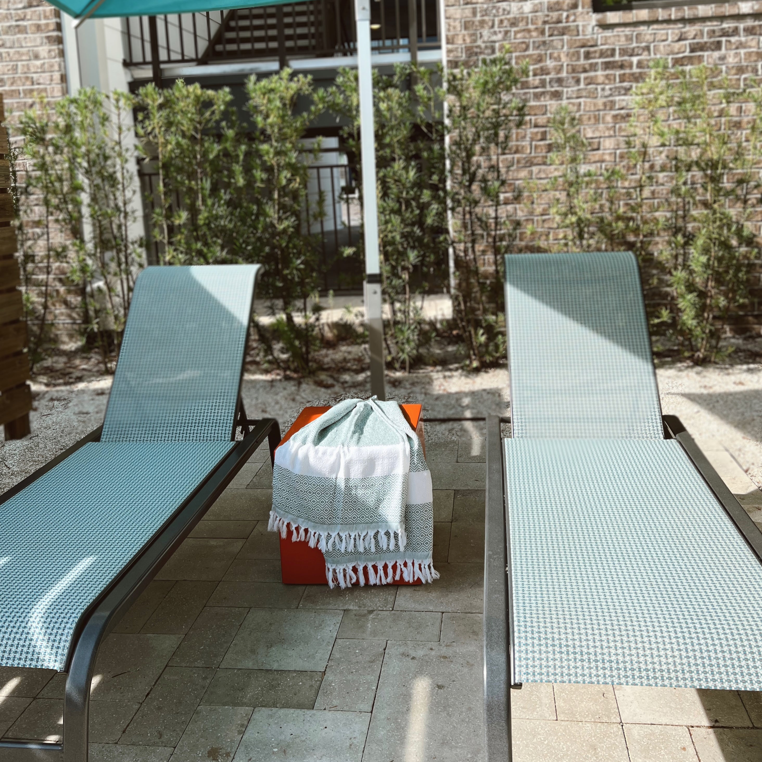 Haley Diamond Towel in blue with decorative tassels, showcasing its oversized design and soft texture.