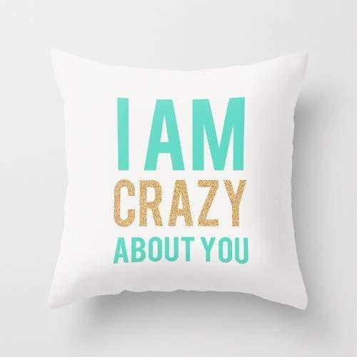 A stylish throw pillow cover featuring the phrase 'I am crzy aboutt you' in a vibrant design, made from 100% spun polyester poplin fabric.