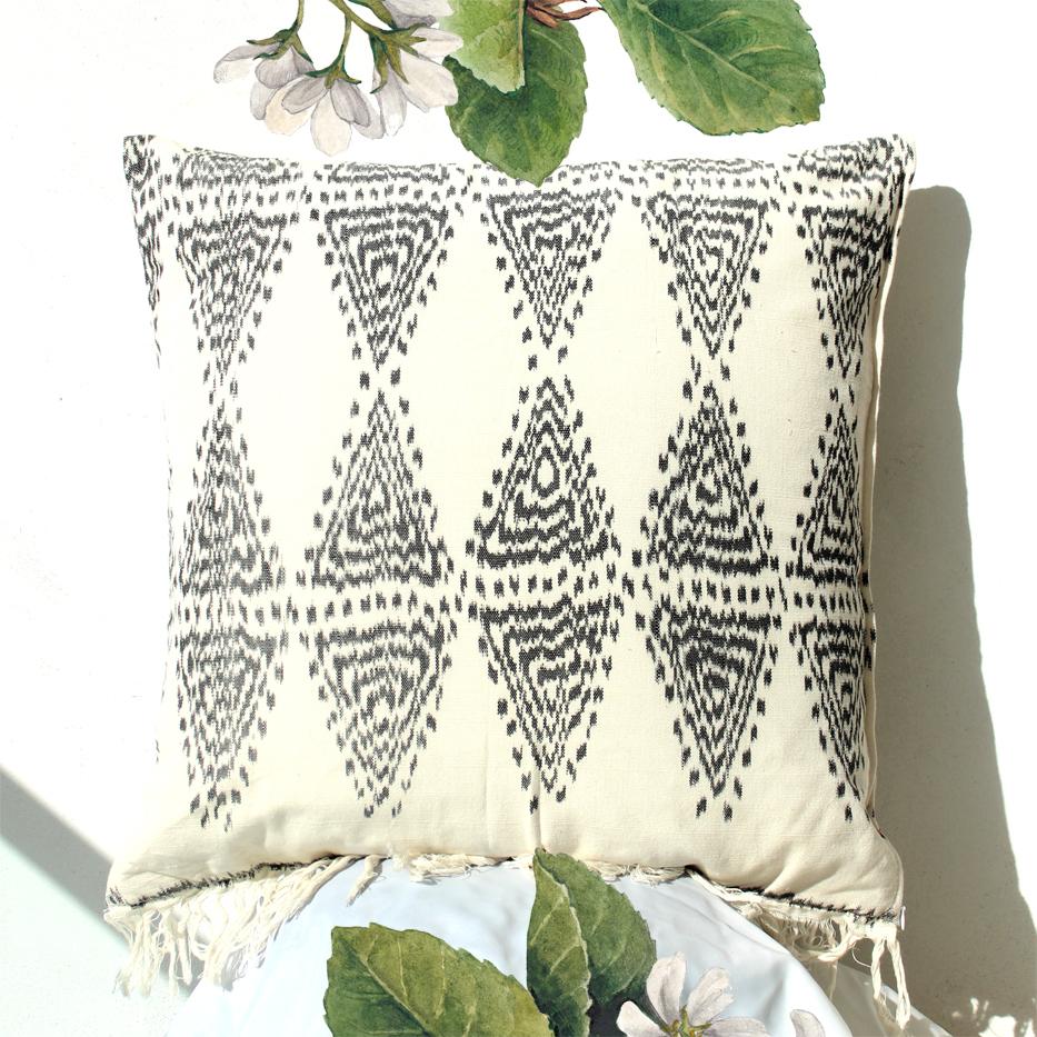 Java Bliss Ikat Pillow featuring handwoven ivory fabric with fringes, perfect for home decor.