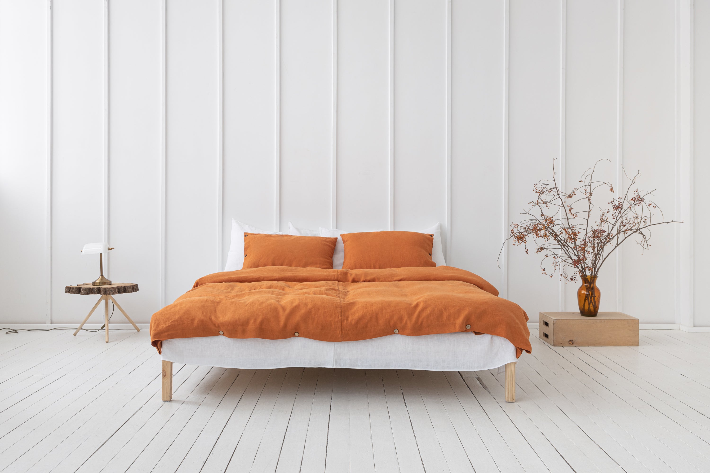 Light Chestnut linen bedding set featuring coconut buttons, elegantly arranged on a bed, showcasing its soft texture and natural color.