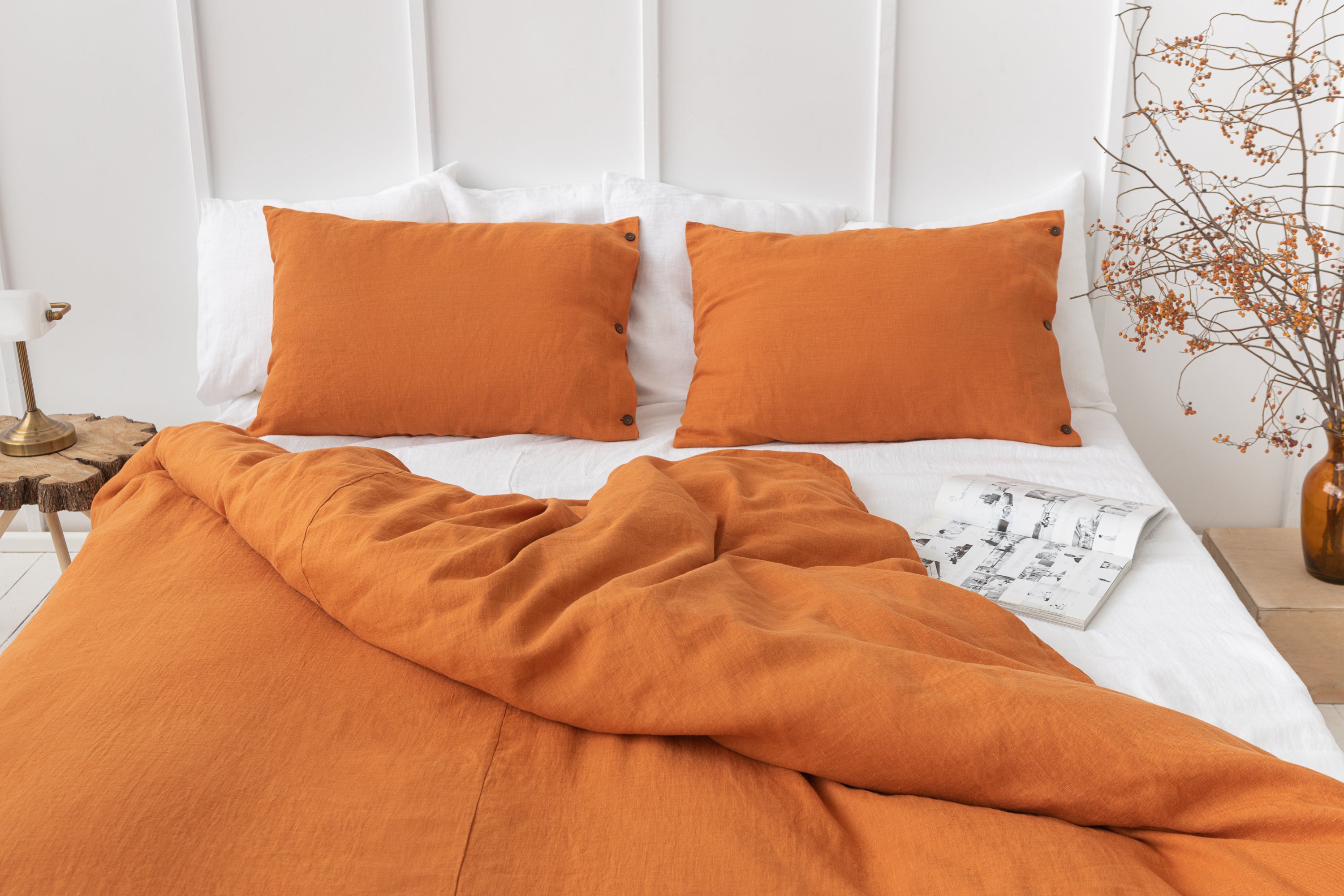 Light Chestnut linen bedding set featuring coconut buttons, elegantly arranged on a bed, showcasing its soft texture and natural color.