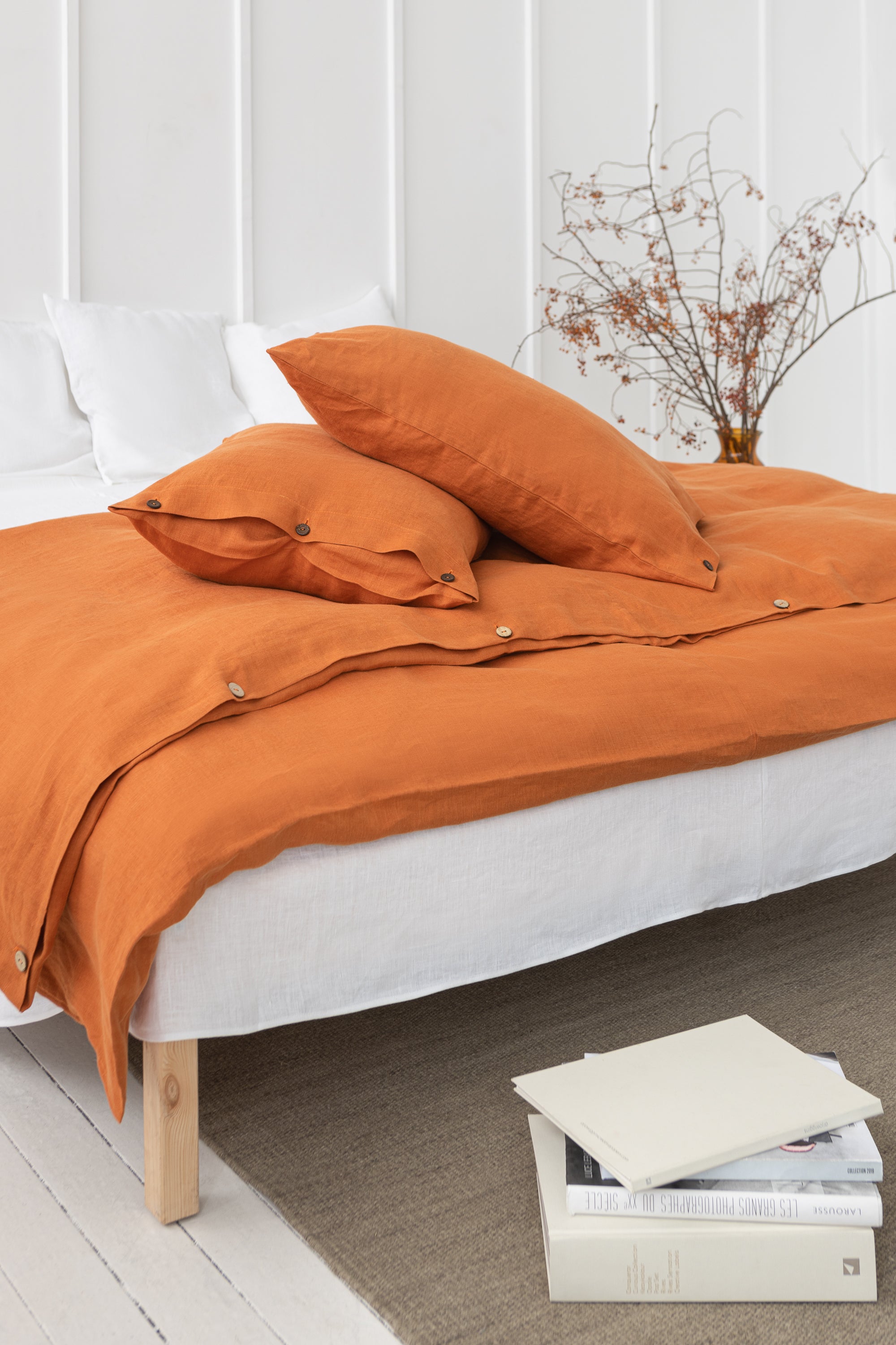 Light Chestnut linen bedding set featuring coconut buttons, elegantly arranged on a bed, showcasing its soft texture and natural color.