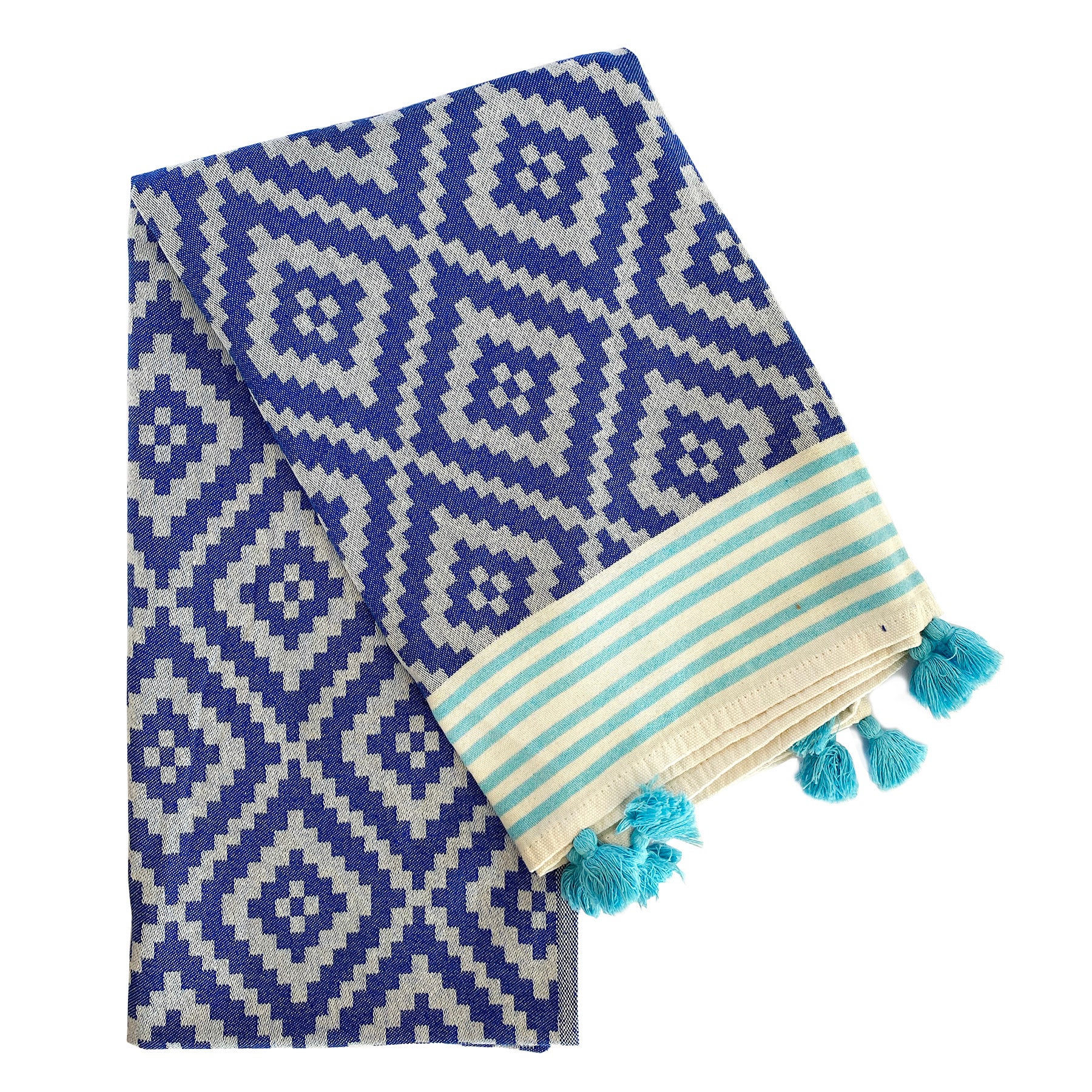 Merida Turkish Towel in blue with hand-knotted tassels, showcasing its unique design and eco-friendly materials.