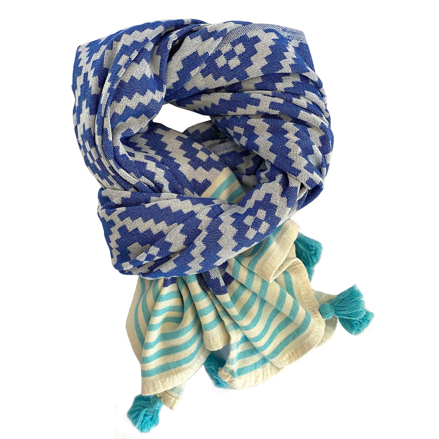 Merida Turkish Towel in blue with hand-knotted tassels, showcasing its unique design and eco-friendly materials.