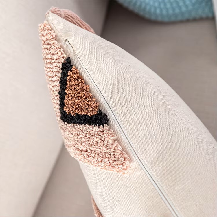 A stylish Moroccan Cushion Cover in pink tufted design, showcasing its elegant texture and quality materials.