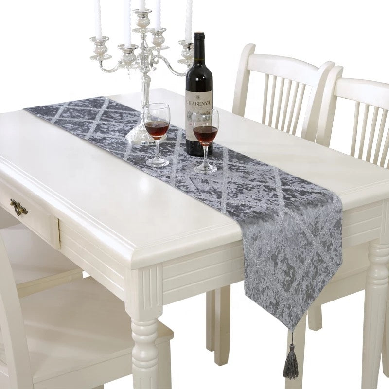 Luxurious velvet table runner in multiple designs, perfect for weddings and parties, elegantly draped over a banquet table.