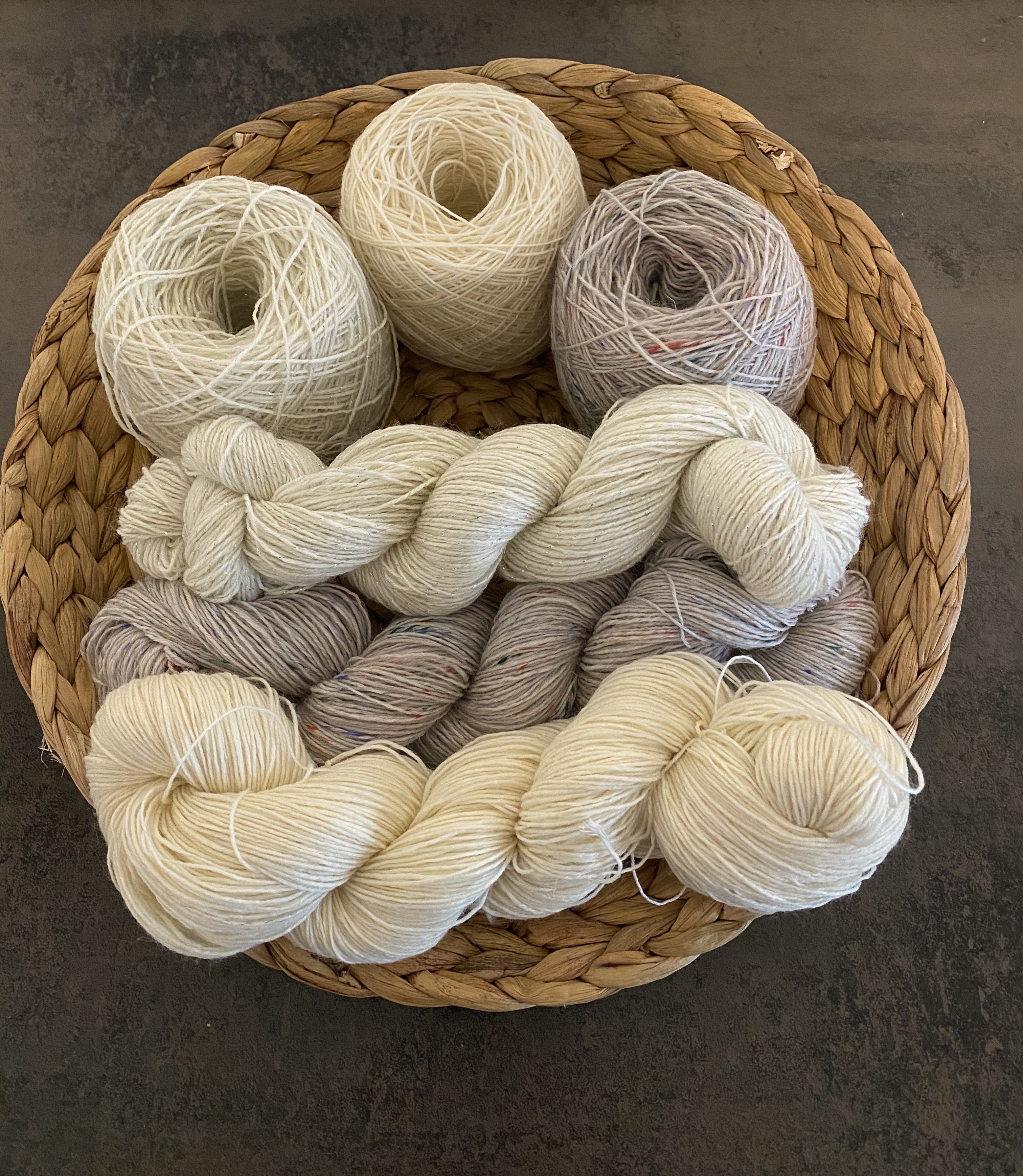 Basket of assorted yarn skeins.