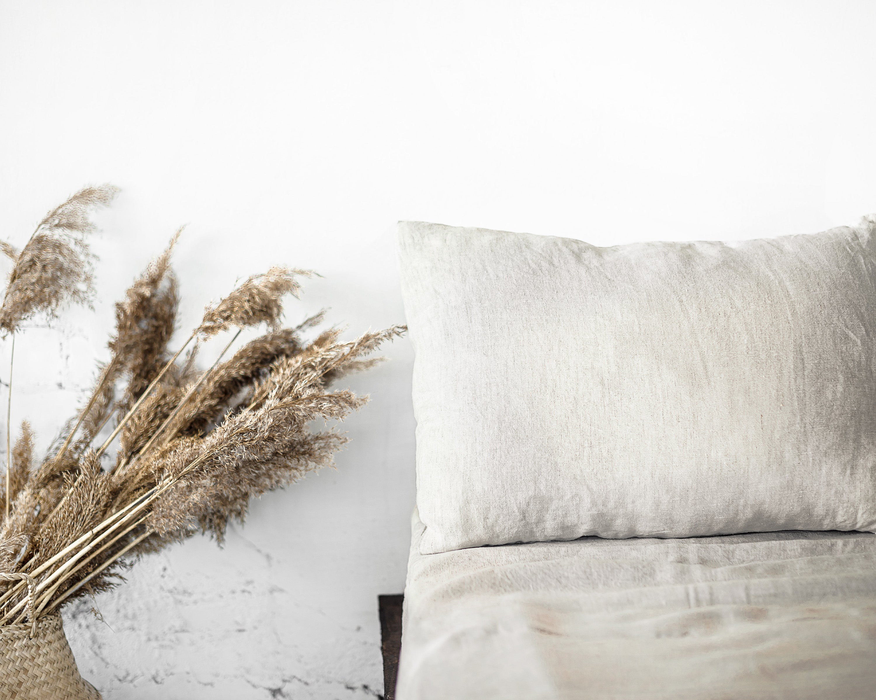 Natural Light linen bedding set featuring a duvet cover with ties, bedsheet, and pillowcases in a soft, elegant design.