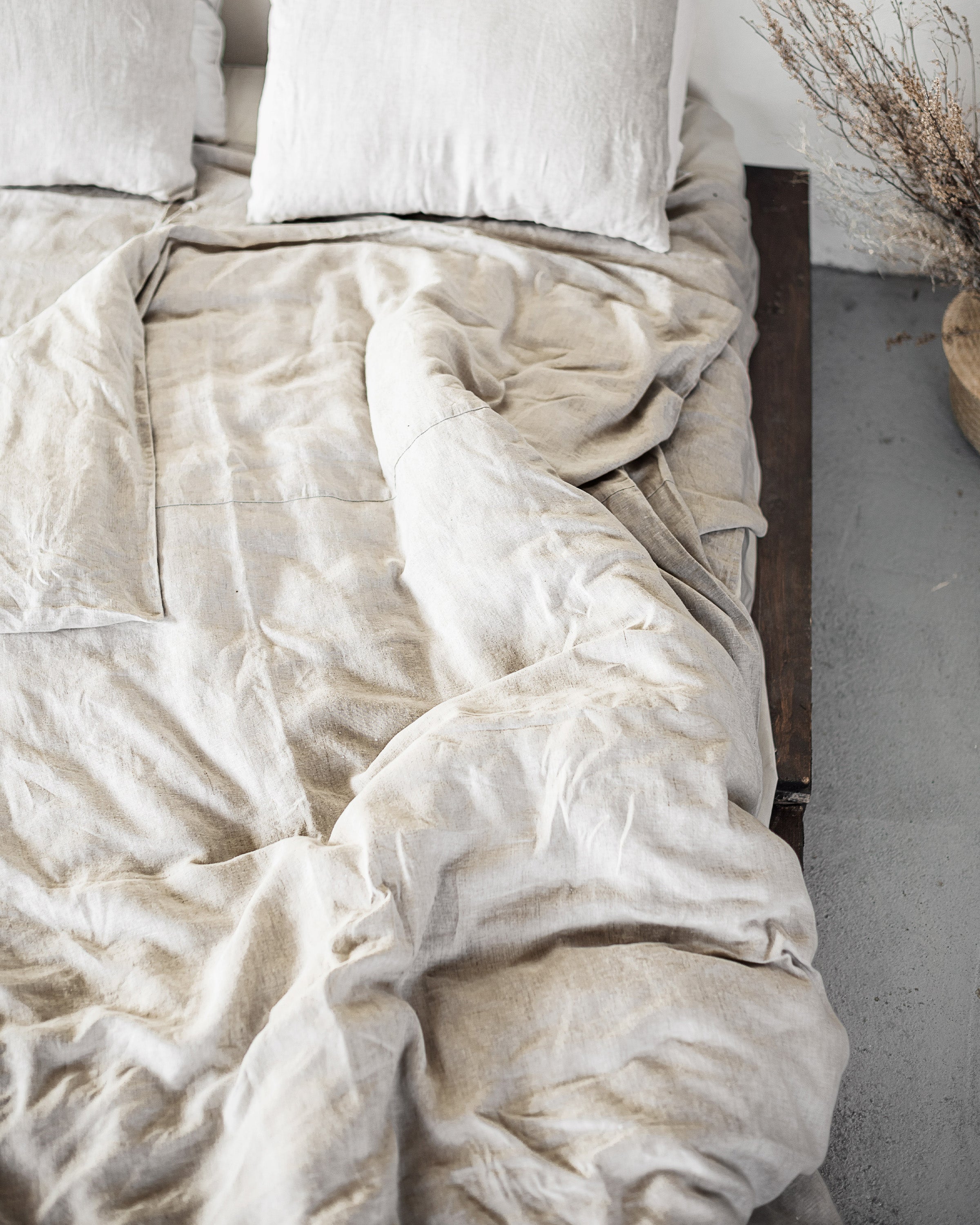 Natural Light linen bedding set featuring a duvet cover with ties, bedsheet, and pillowcases in a soft, elegant design.