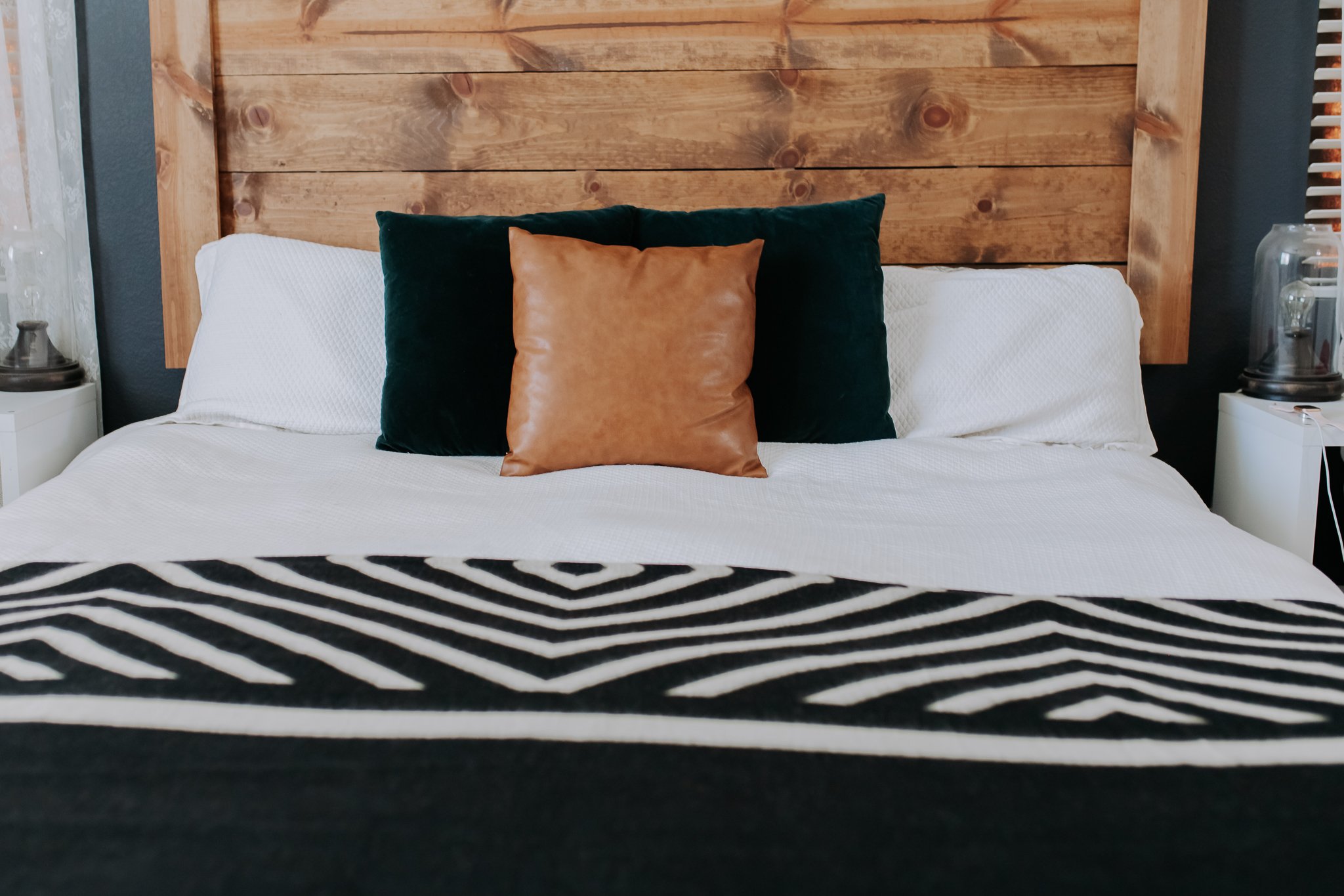 Paramo Blanket in Natural and Black, showcasing its elegant monochromatic design and soft texture, perfect for home decor or outdoor use.