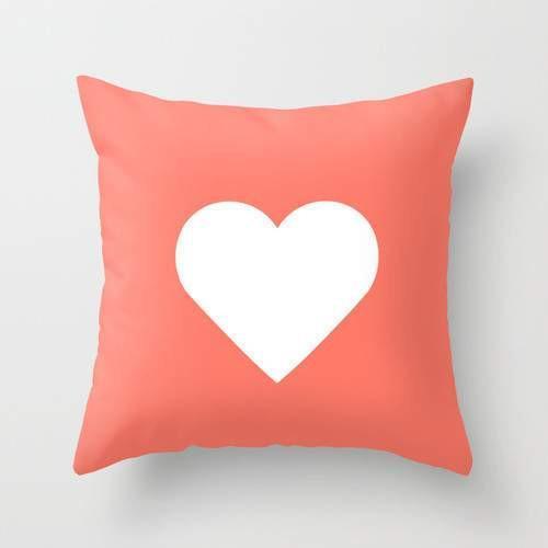 A vibrant peach heart throw pillow cover, 16x16 inches, showcasing a double-sided print with a concealed zipper.