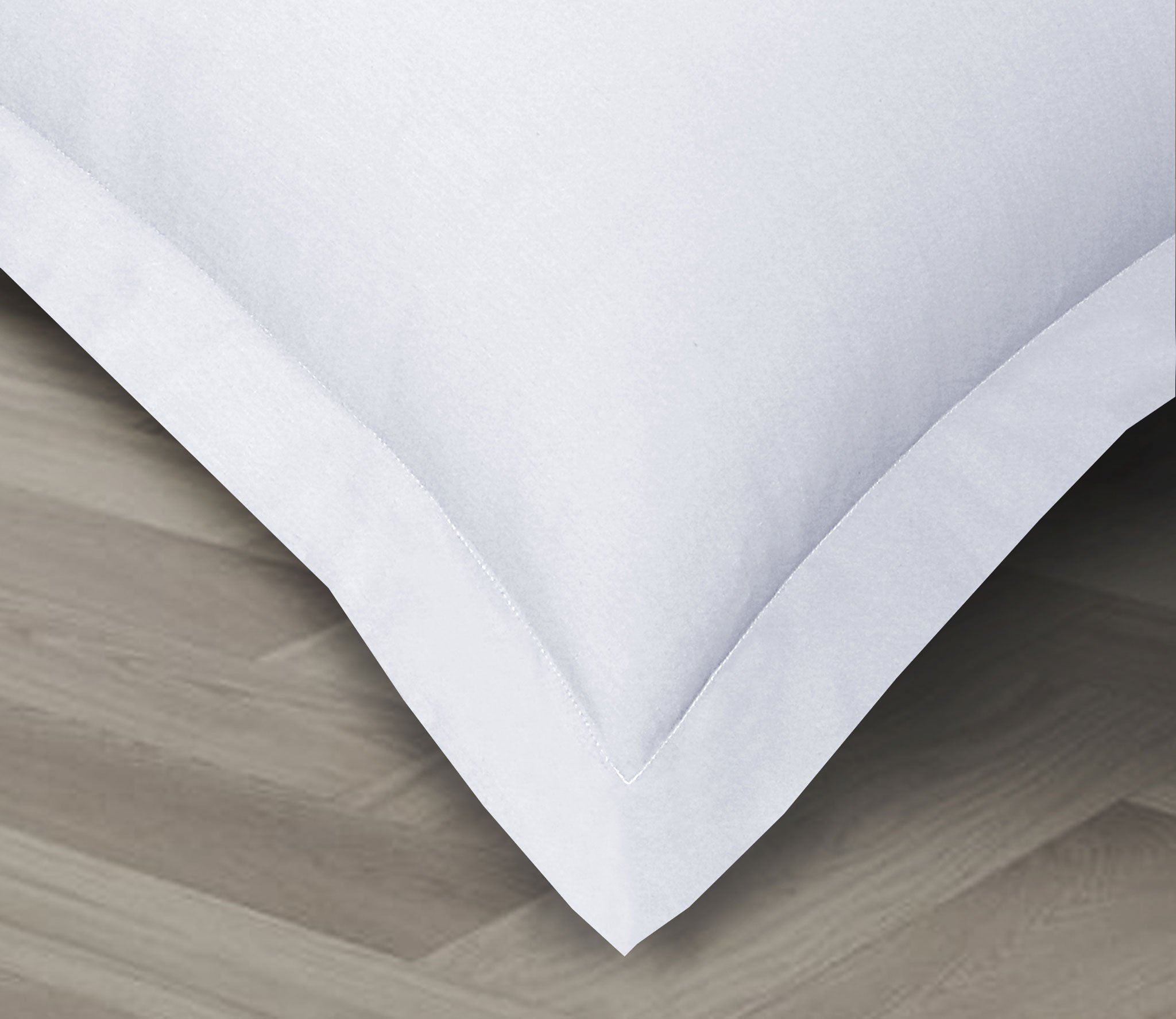 A set of two crisp, lightweight Percale pillowcases made from 100% cotton, showcasing their smooth texture and elegant design.