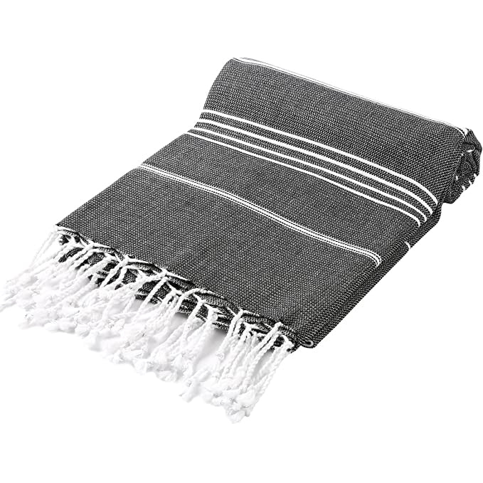Pure Series Sustainable Turkish Towel in Black, made from recycled cotton, showcasing its lightweight and compact design.