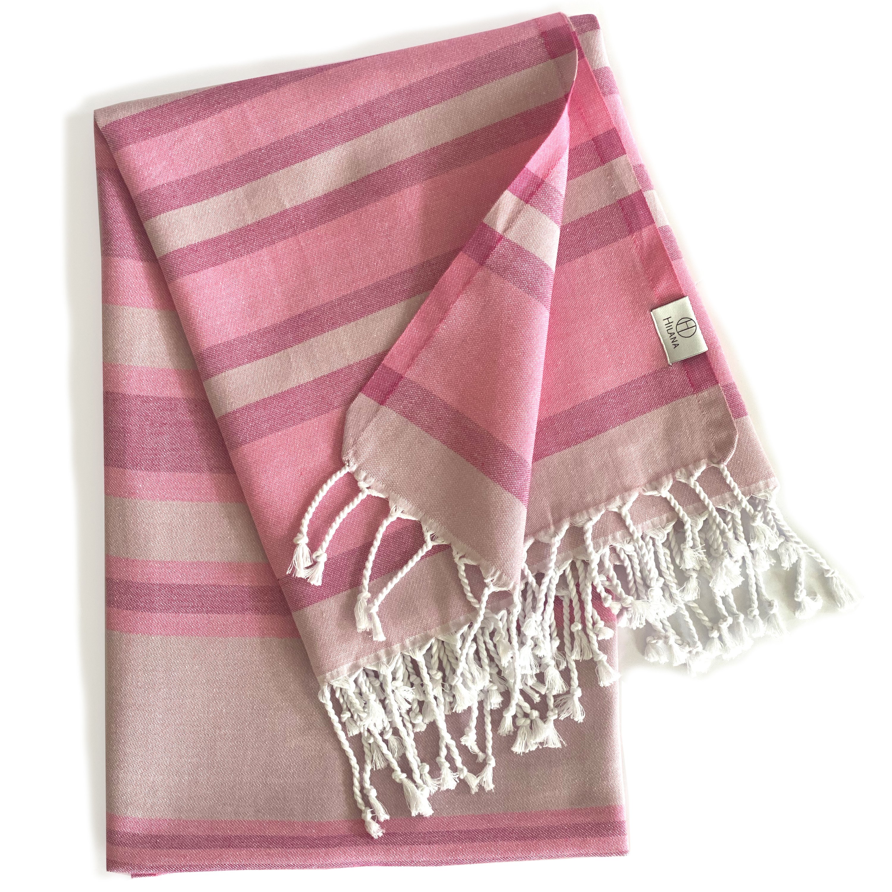Samara Sustainable Turkish Towel in Pink with hand-tied tassels, showcasing its soft texture and eco-friendly design.