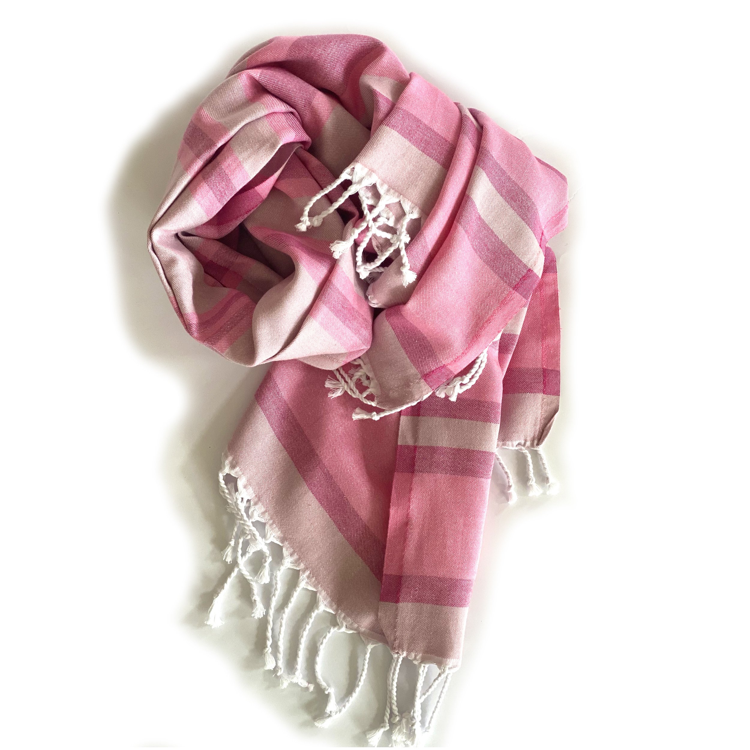 Samara Sustainable Turkish Towel in Pink with hand-tied tassels, showcasing its soft texture and eco-friendly design.