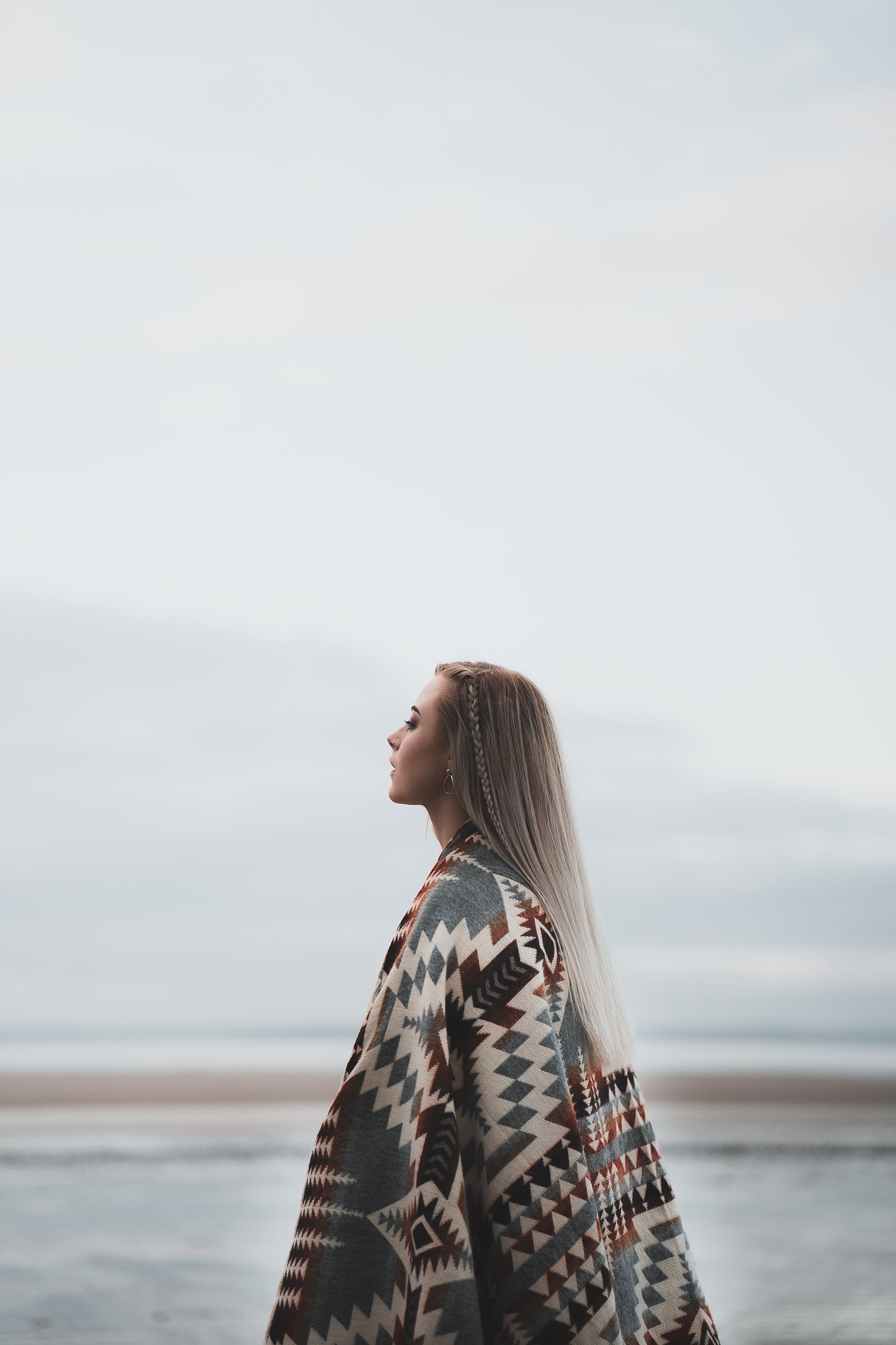 Secoya Blanket in Mint, handcrafted from recycled acrylic, showcasing reversible colors and a cozy design, perfect for indoor and outdoor use.