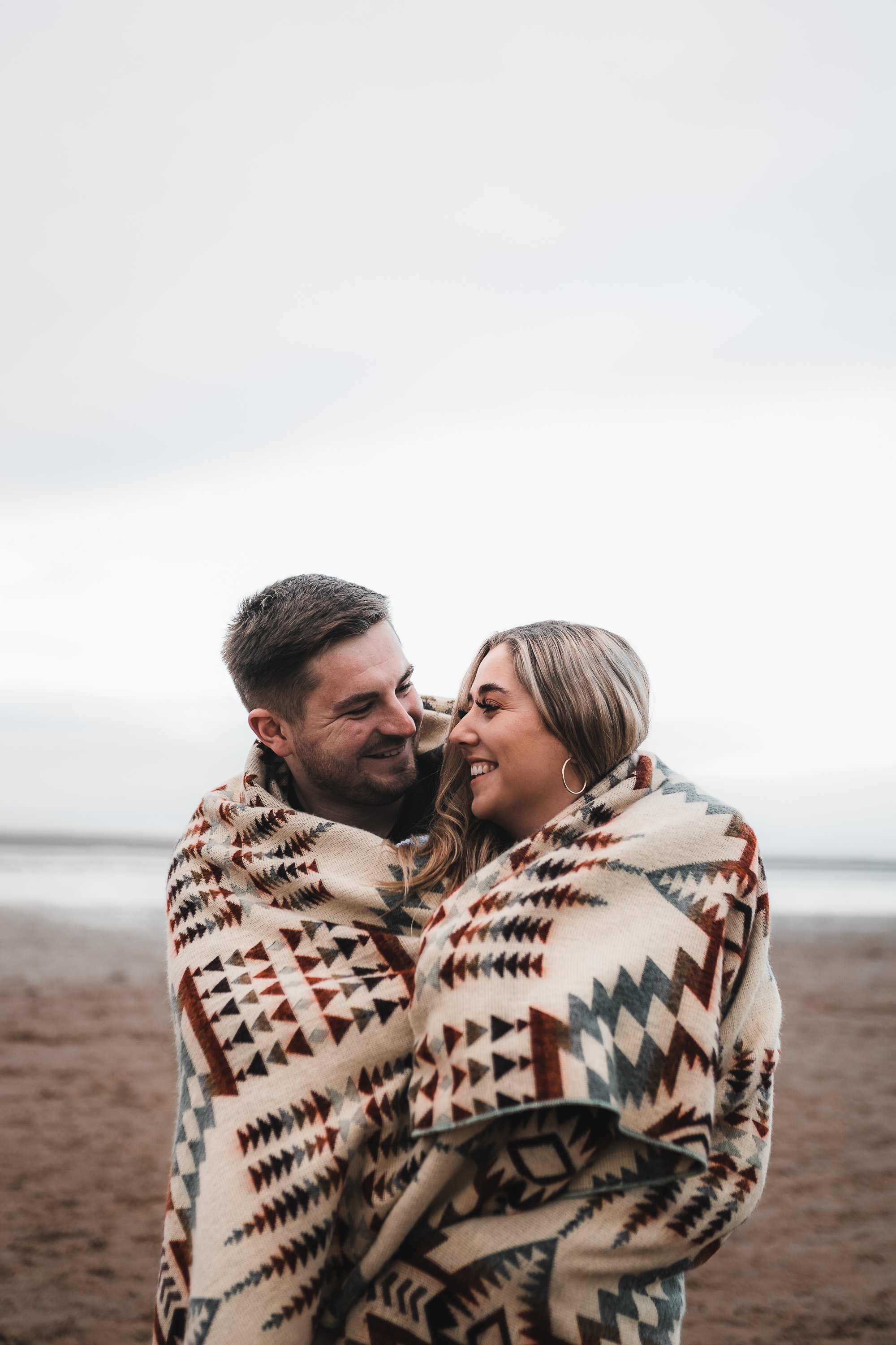 Secoya Blanket in Mint, handcrafted from recycled acrylic, showcasing reversible colors and a cozy design, perfect for indoor and outdoor use.