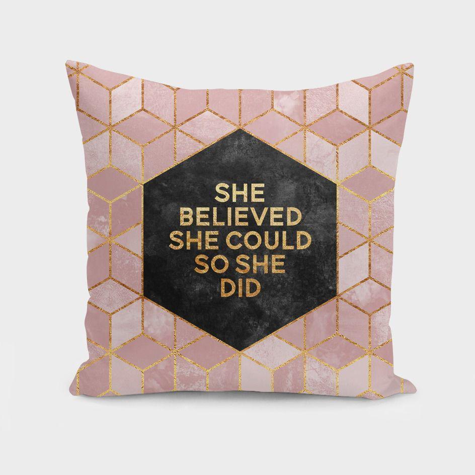 A stylish throw pillow featuring the quote 'She believed she could, so she did' on a vibrant double-sided print, perfect for home decor.
