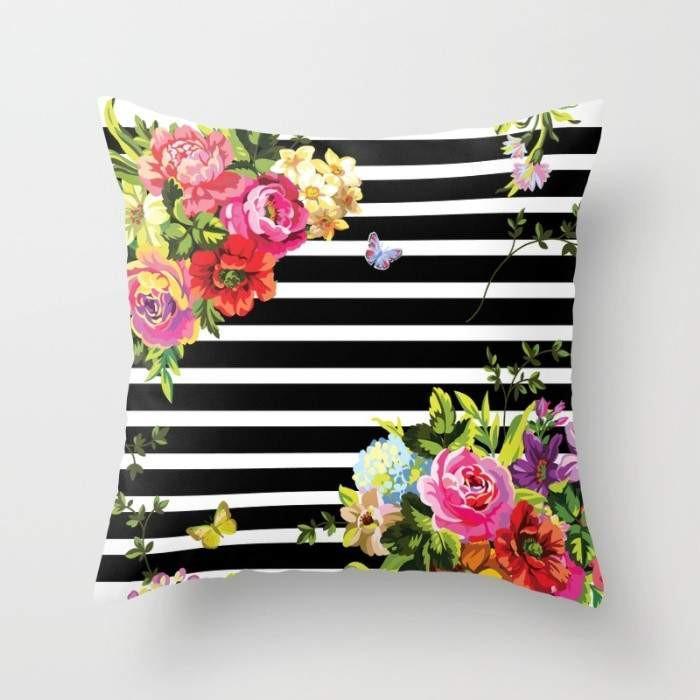 A stylish Stripes Floral Cushion featuring a vibrant floral pattern and elegant stripes, made from durable spun polyester fabric.