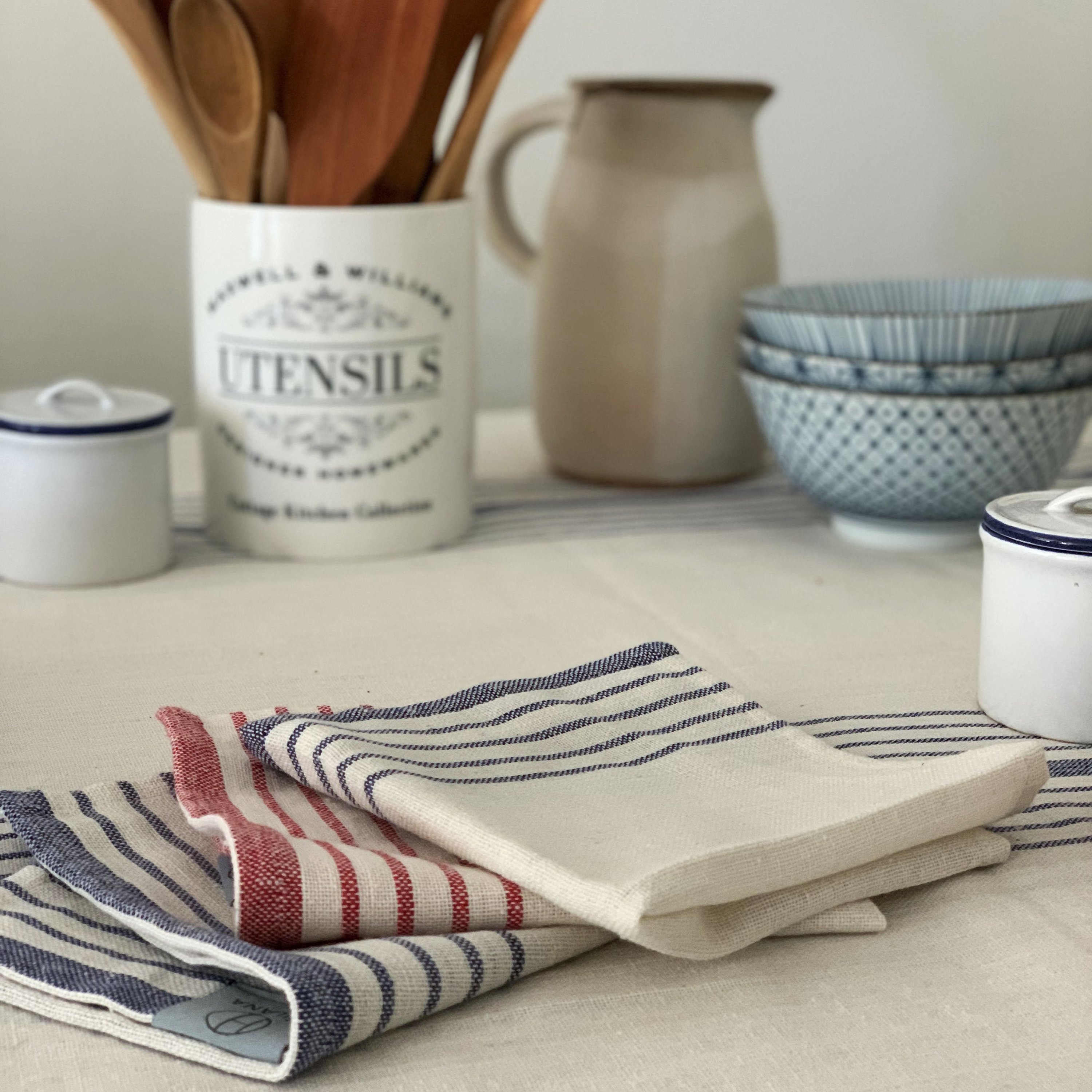 Sustainable Kayseri Tablecloth Set in Blue featuring elegant French stripes and handcrafted tassels, perfect for stylish dining.