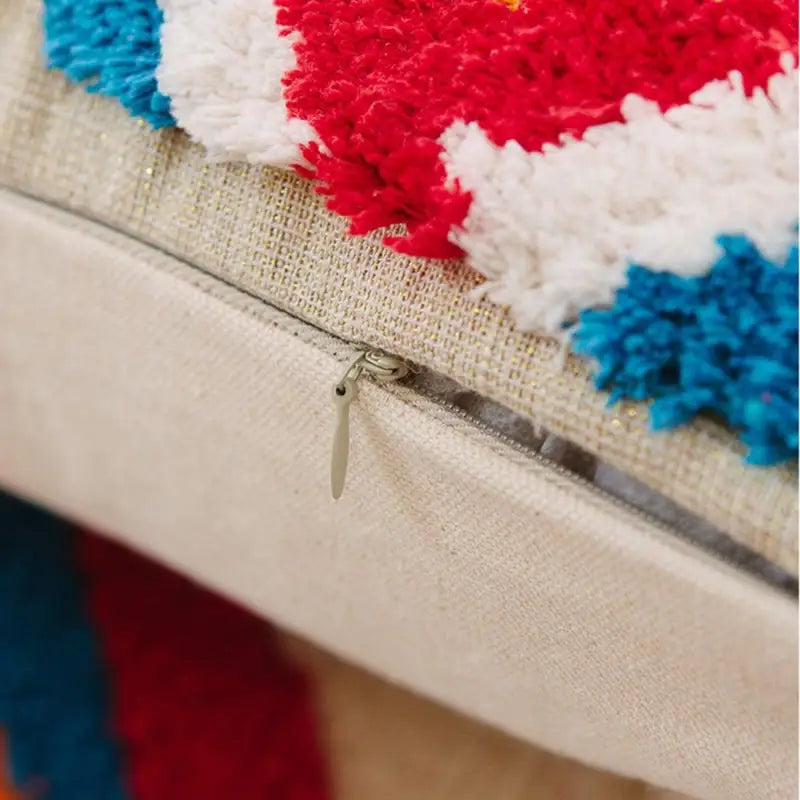 Handmade tassel tufted knitted cushion cover in geometric art design, featuring soft cotton and linen material with a zipper closure.