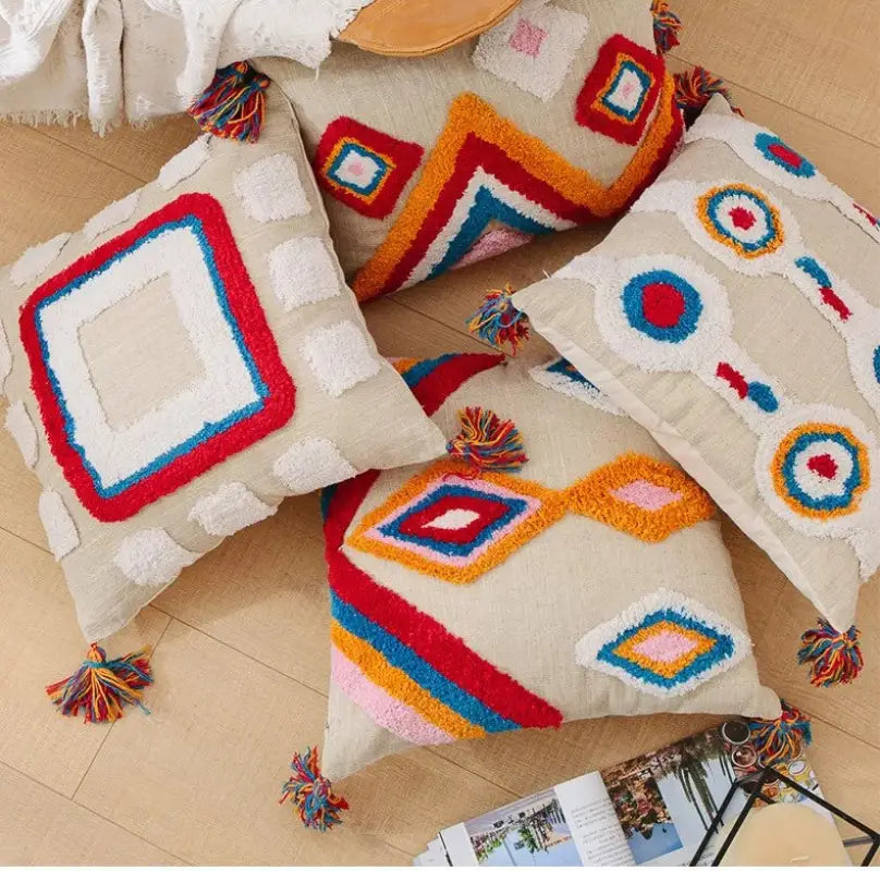 Handmade tassel tufted knitted cushion cover in geometric art design, featuring soft cotton and linen material with a zipper closure.