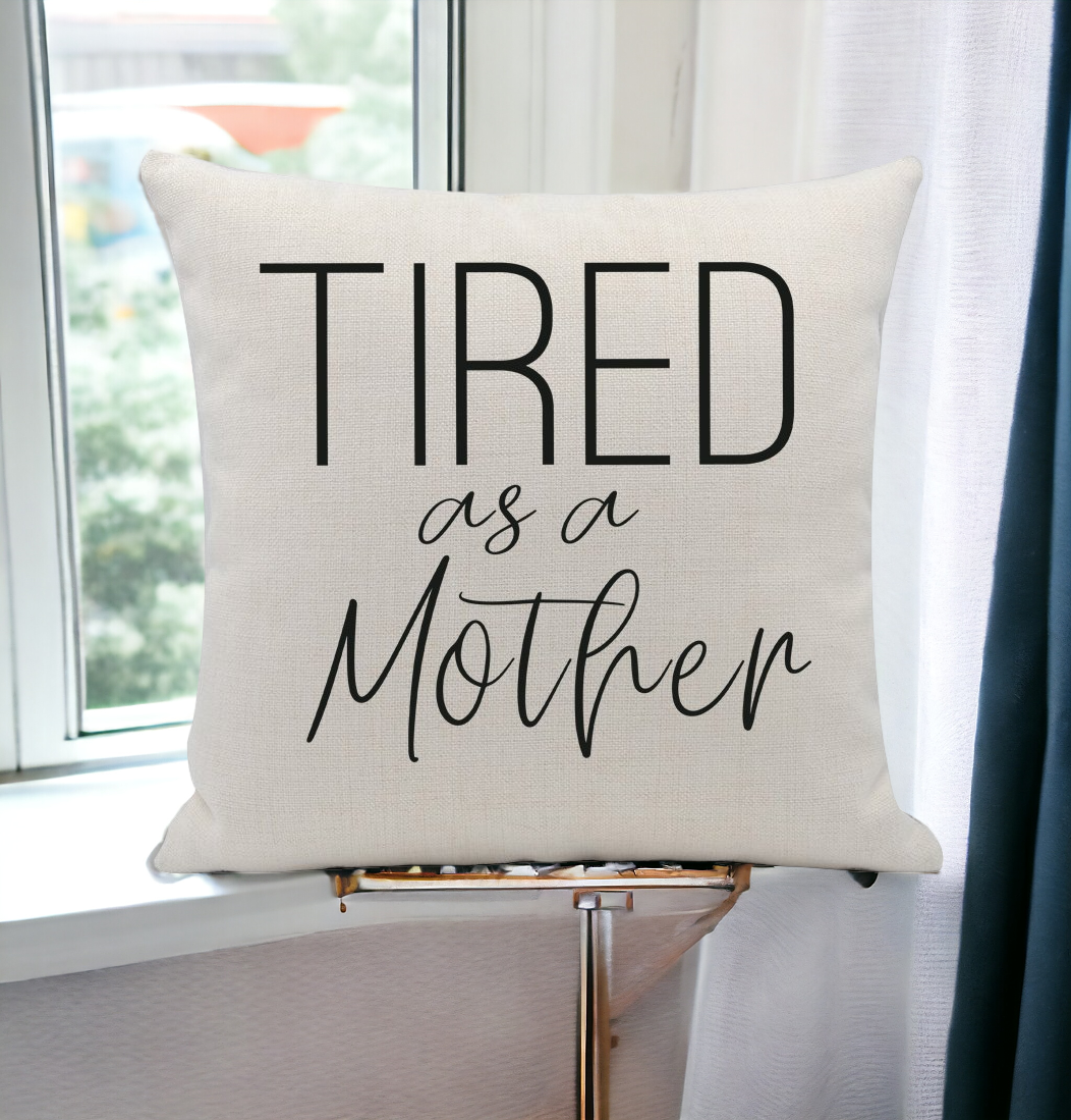 Tired As a Mother cushion cover featuring a humorous embroidery design on a soft linen fabric, perfect for home decor.