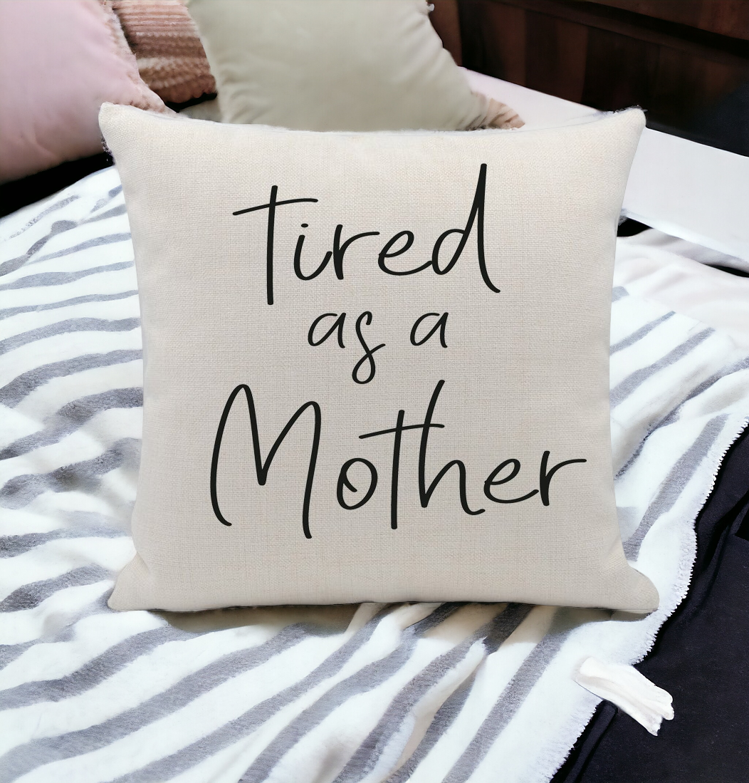Tired As a Mother cushion cover featuring a humorous embroidery design on a soft linen fabric, perfect for home decor.