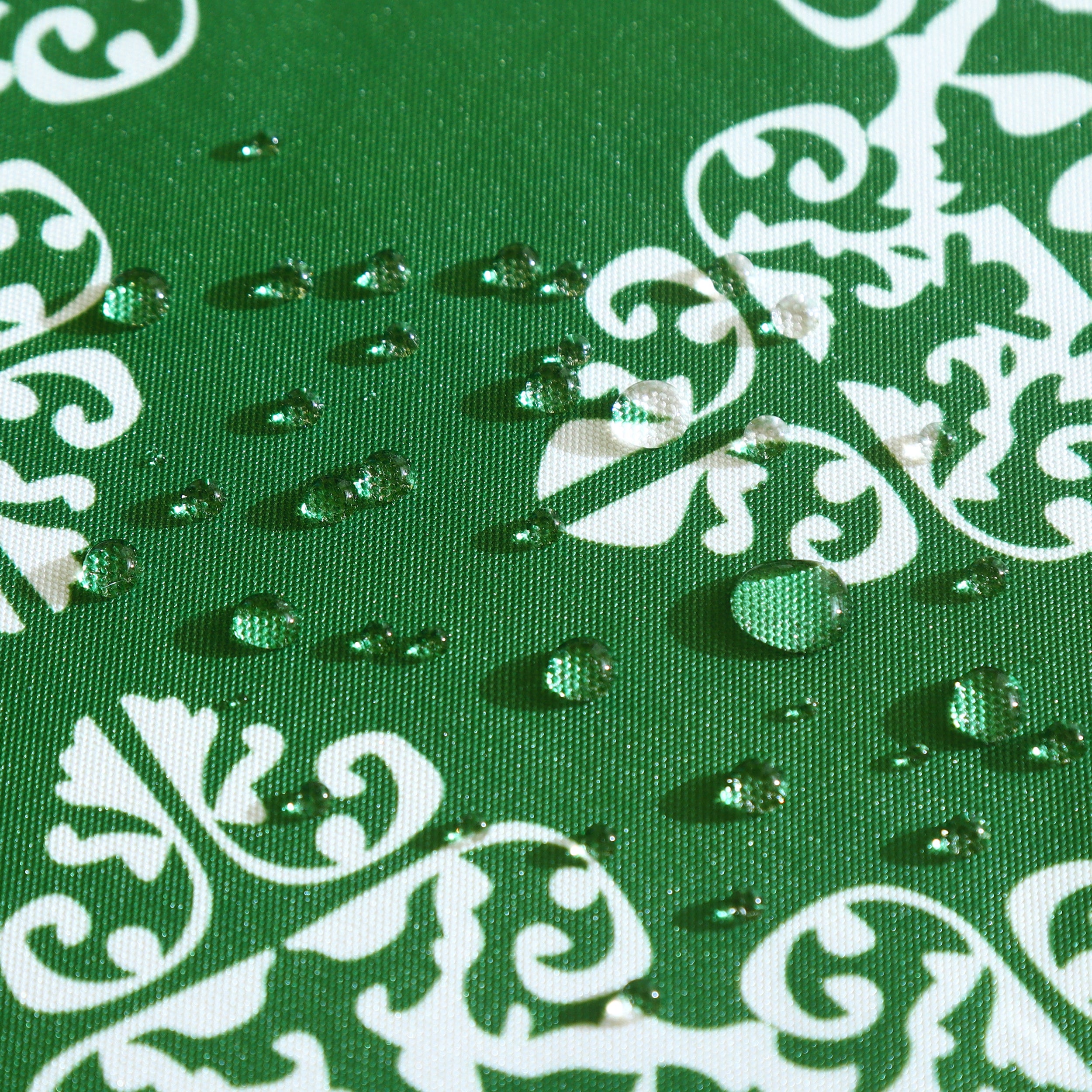 Water resistant green table cloth with geometric pattern, suitable for indoor and outdoor use.