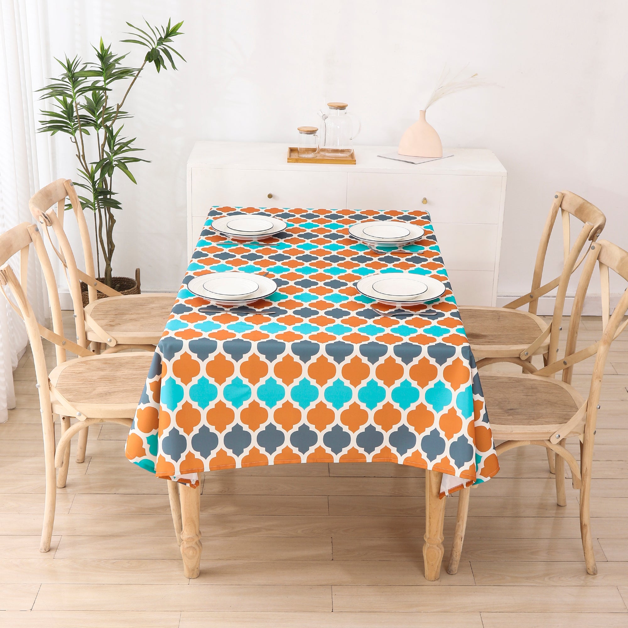 Water resistant indoor outdoor table cloth in vibrant orange with geometric pattern, measuring 137x185 CM, suitable for various occasions.