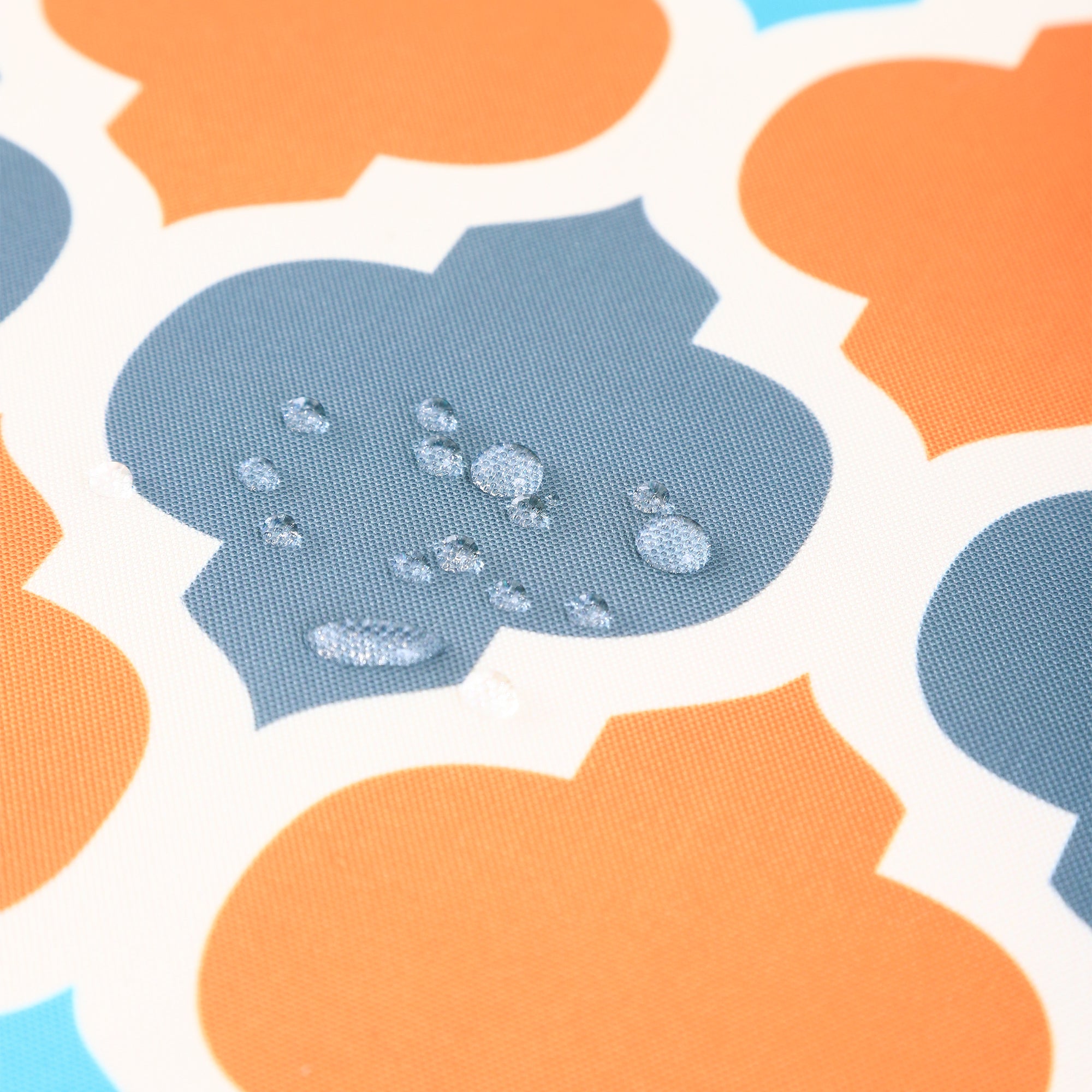 Water resistant indoor outdoor table cloth in vibrant orange with geometric pattern, measuring 137x185 CM, suitable for various occasions.