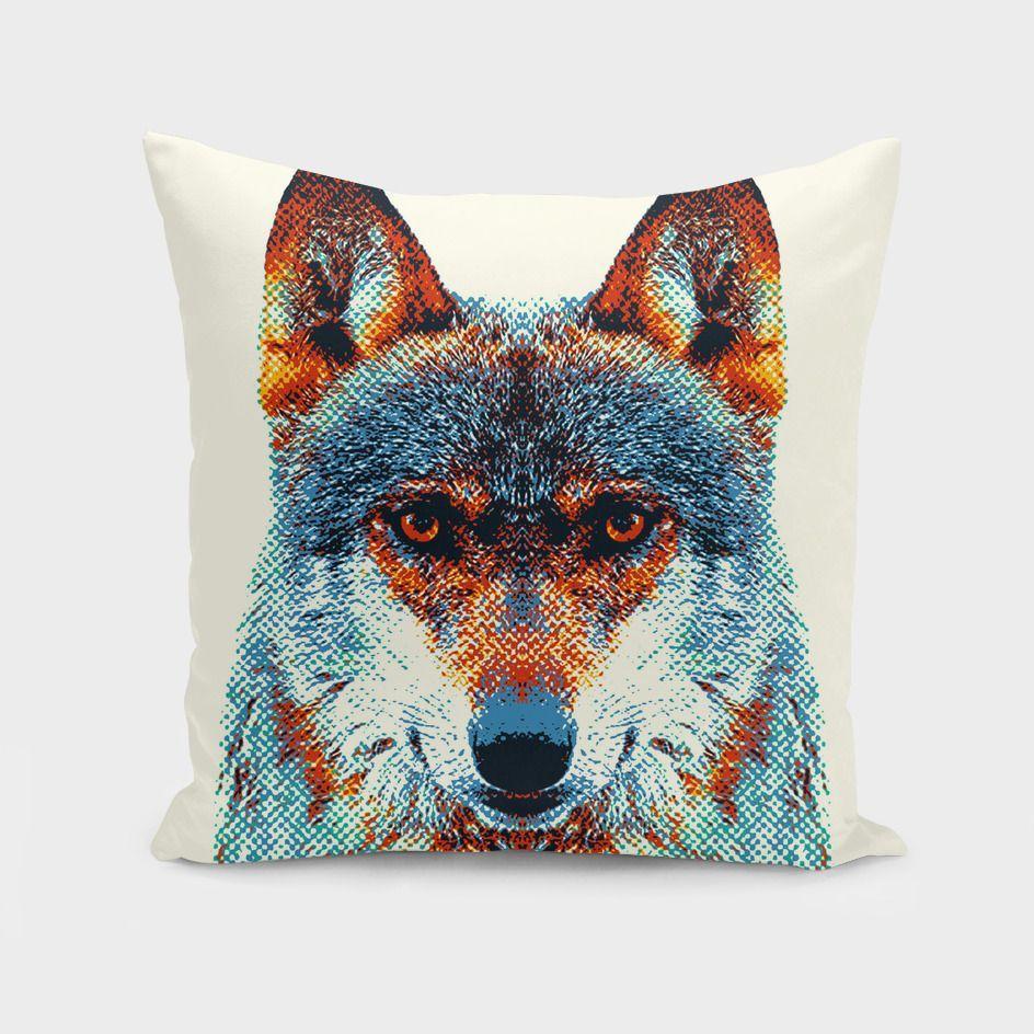 Colorful wolf illustration on pillow.