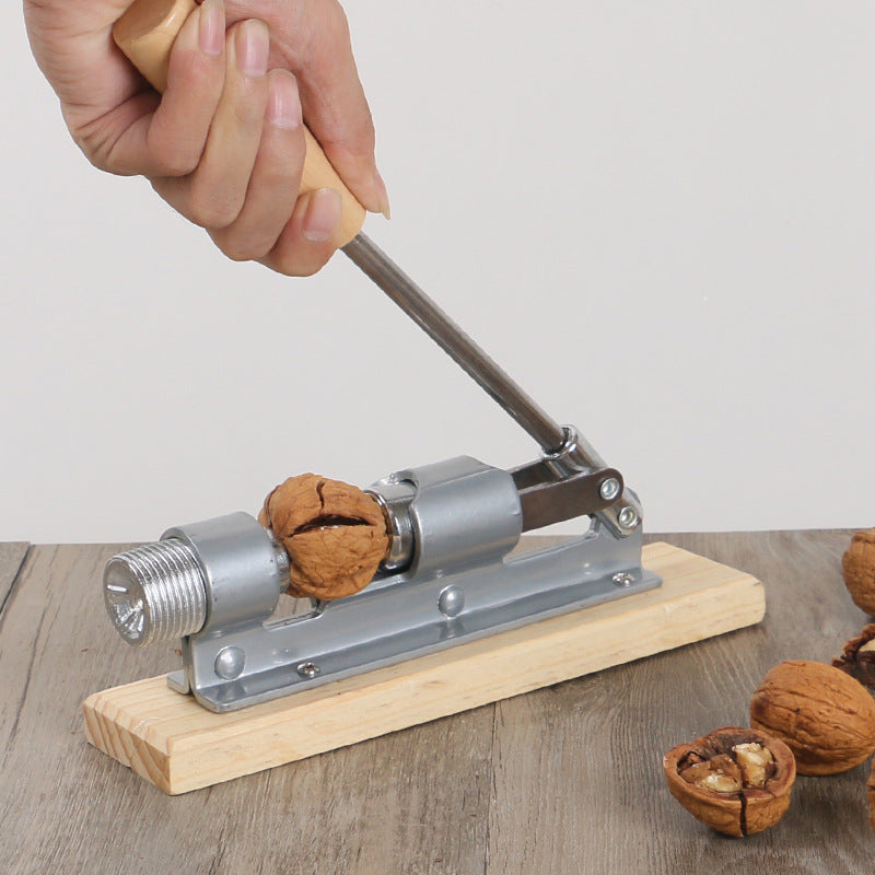 Mechanical Whole-grain Peeling Walnut Clip Nuclear Opener made of stainless steel and wood, designed for easy nut cracking.
