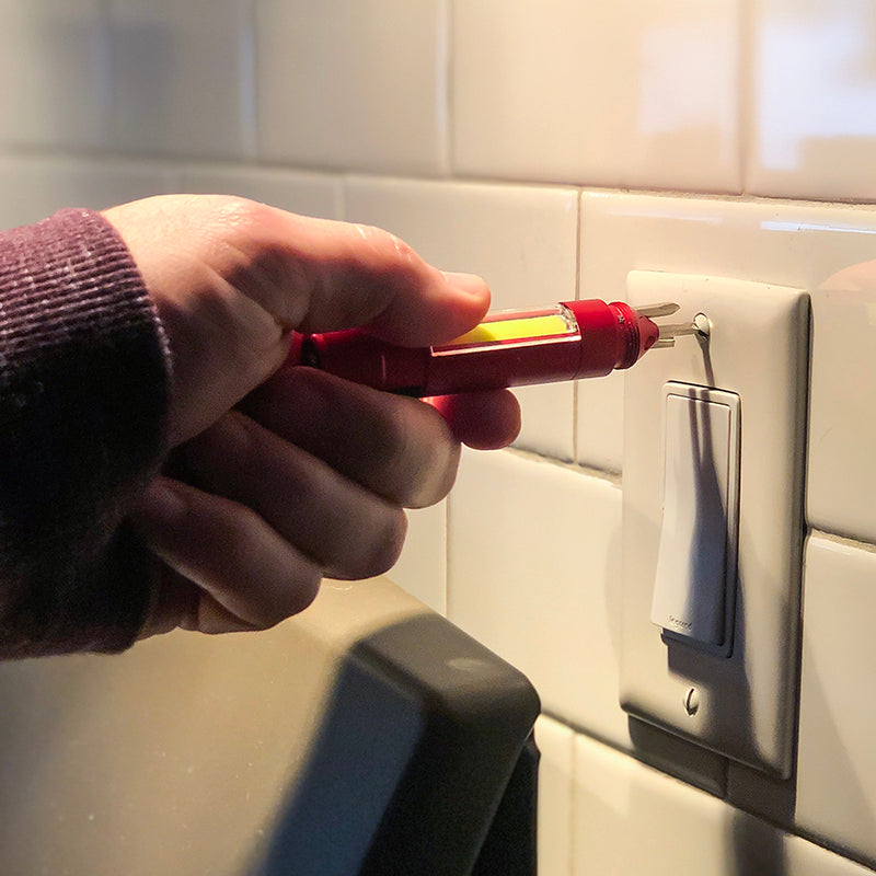 Stinger Multi-Tool featuring COB LED task light and integrated screwdriver set, showcasing its compact design and magnetic base.