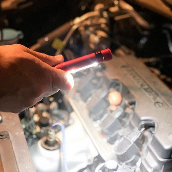 Stinger Multi-Tool featuring a COB LED task light and screwdriver set, showcasing its compact design and integrated pocket clip.