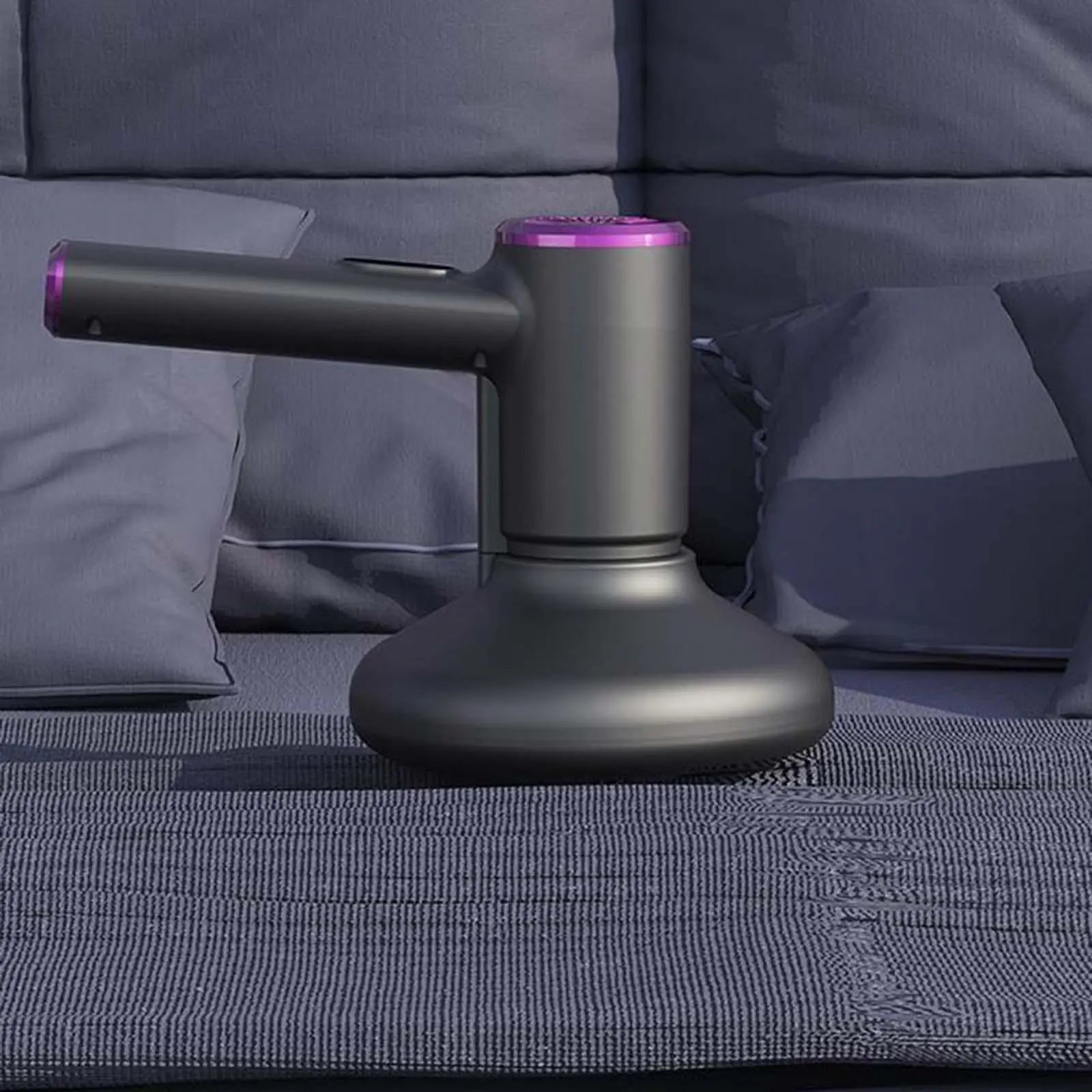Handheld vacuum cleaner designed for effective cleaning of beds, carpets, and furniture, showcasing its sleek design and powerful suction capabilities.