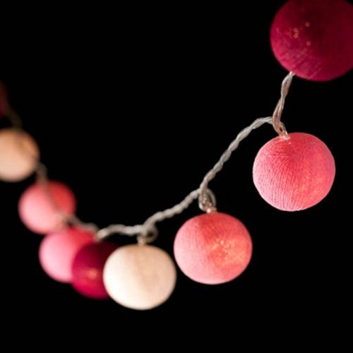 A set of 20 pink cotton ball string lights, battery powered, perfect for decoration.