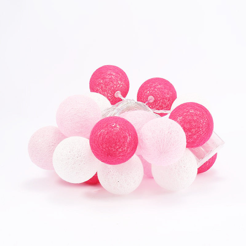 A set of 20 pink cotton ball string lights, battery powered, perfect for decoration.