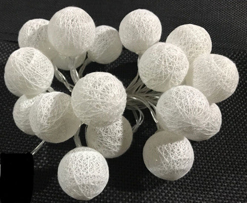 A set of 20 white cotton ball string lights, battery powered, perfect for indoor and outdoor decoration.