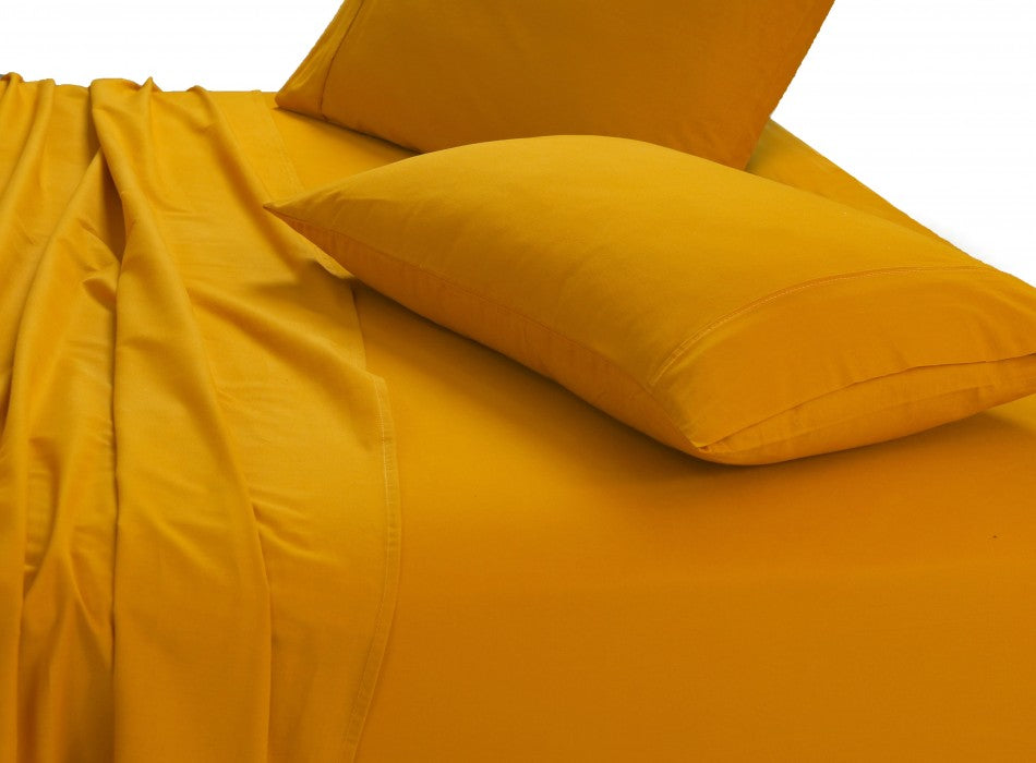 100% Egyptian Cotton Vintage Washed 500TC Mustard King Bed Sheets Set displayed on a bed, showcasing its luxurious texture and elegant design.