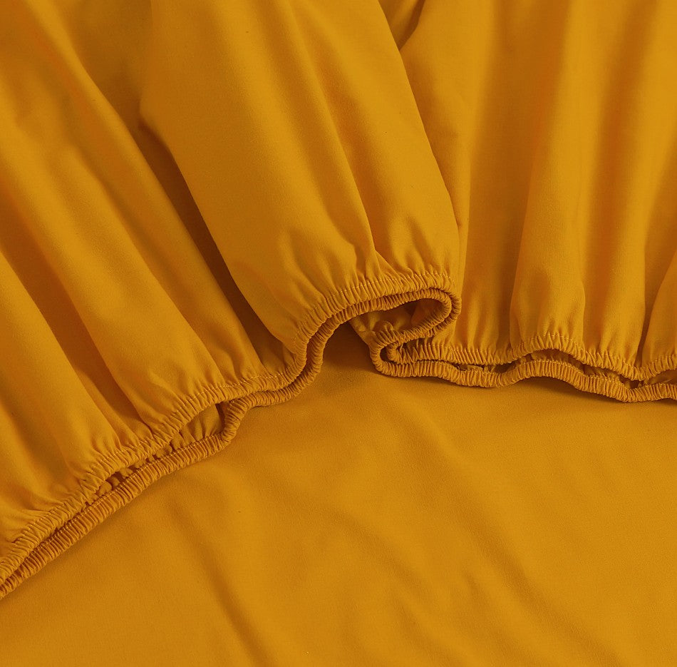 100% Egyptian Cotton Vintage Washed 500TC Mustard King Bed Sheets Set displayed on a bed, showcasing its luxurious texture and elegant design.