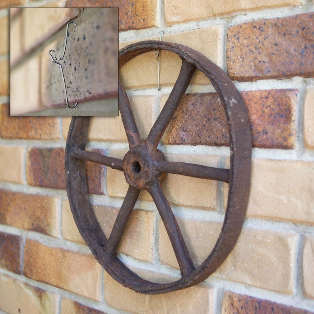 A pack of 10 Bric Crab Brick Hooks designed for hanging items on external bricks, showcasing their stainless steel construction and spring design.