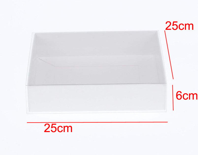A stack of 10 white card boxes with clear slide-on lids, measuring 25 x 25 x 6 cm, ideal for packaging gifts and food displays.